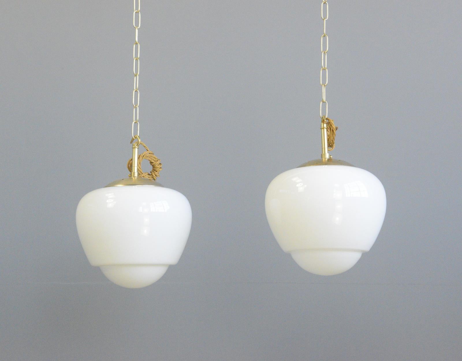 Czech Teardrop Opaline pendant lights circa 1940s

- Brass tops
- Elegant shaped opaque glass 
- Comes with 100cm of gold twist cable, brass chain and ceiling rose
- Takes E27 fitting bulbs
- Czech ~ Circa 1940s
- 25cm wide x 30cm