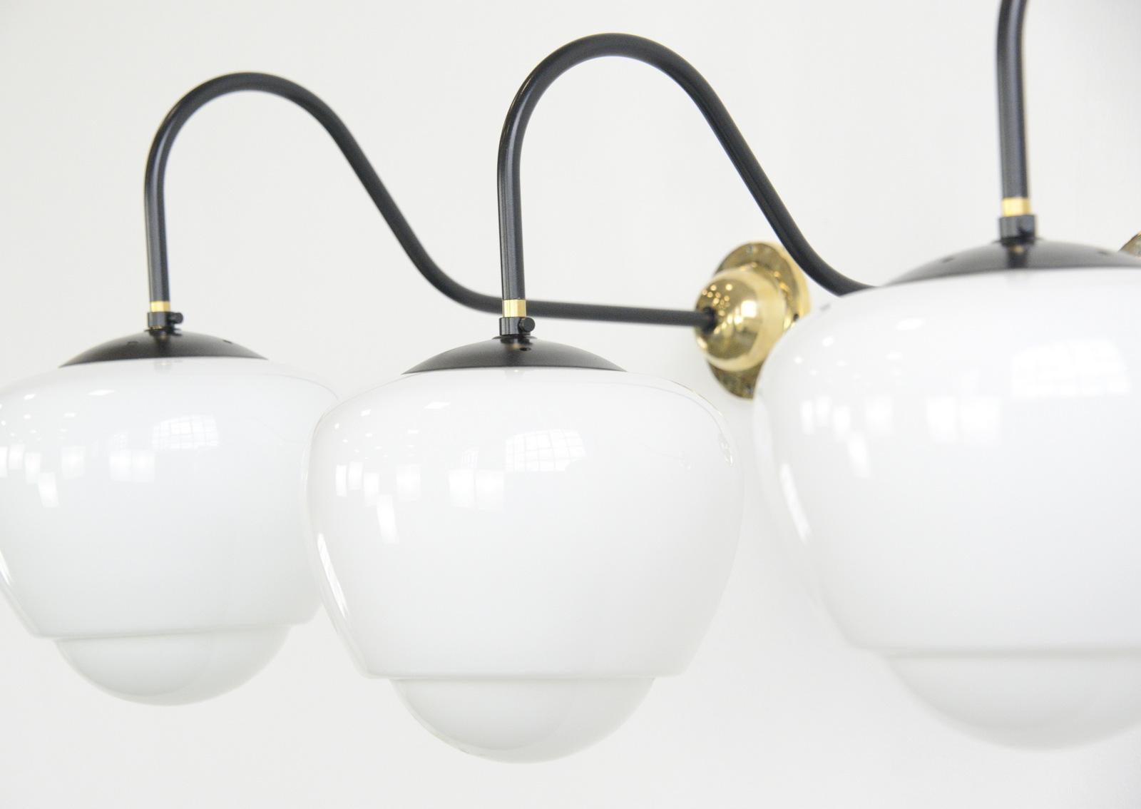 Czech teardrop opaline wall lights circa 1940s

- Teardrop shaped opaline glass
- Curved arm with cast brass wall plate
- Wires directly into the wall
- Takes E27 fitting bulbs
- Czech ~ 1940s
- Measures: 62cm deep x 22cm wide x 40cm