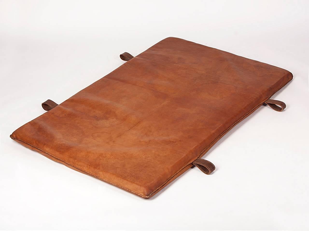 This 1930s gym mat originates from former Czechoslovakia. It is made from thick leather and features a very good patina. Surface has been polished, all sides have been re-sewn. The mat is in a very good condition.
 