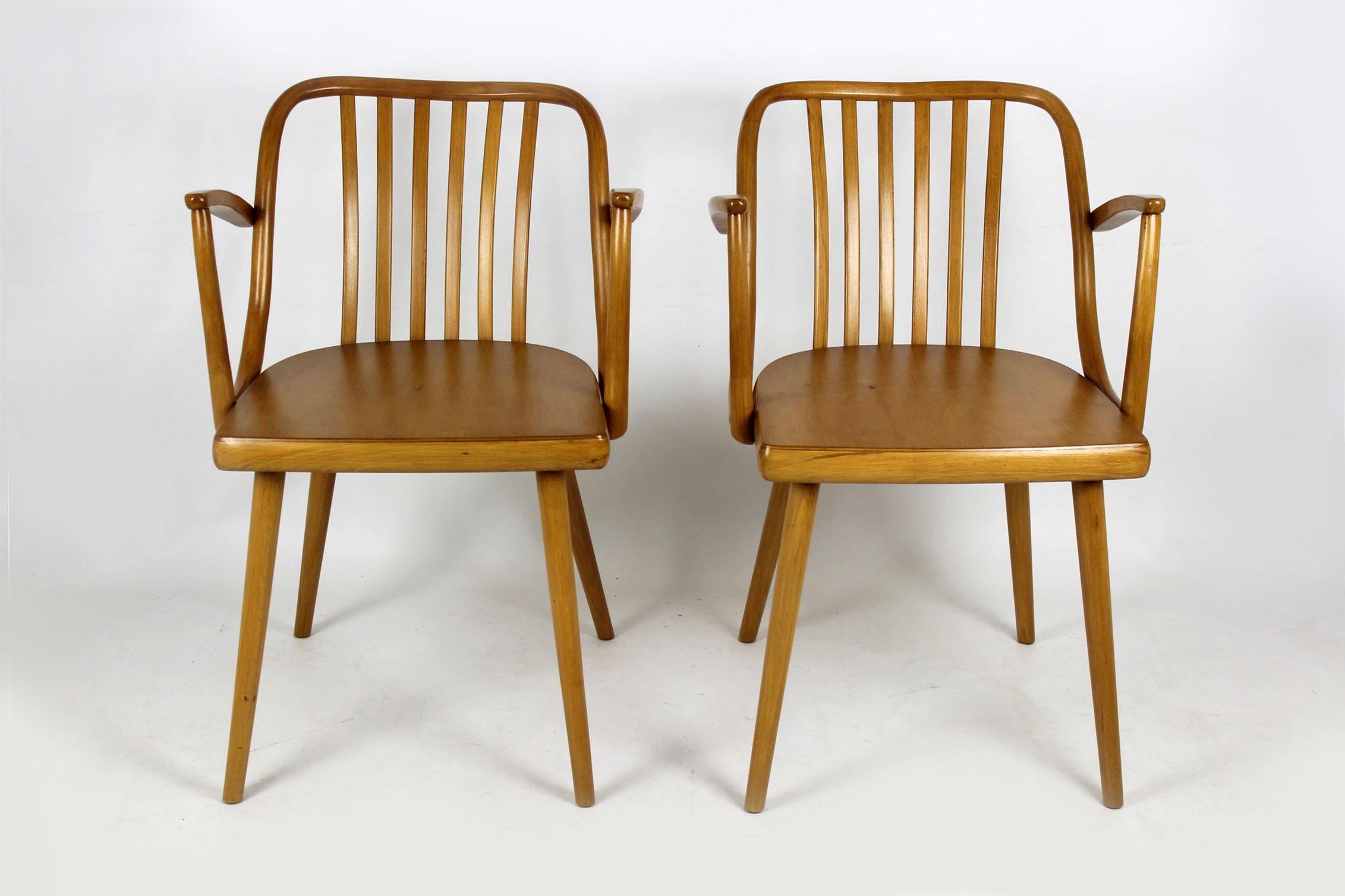 Set of two wooden armchairs designed by Antonin Suman for Ton in the mid-1960s. Backrests made of bent beechwood. Chairs have been completely restored.