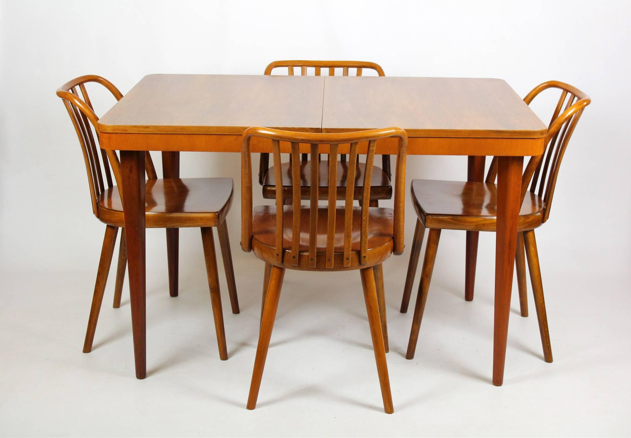 Set of four wooden chairs designed by Antonin Suman for TON (formerly Thonet) in the mid-1960s. Backrests are made of bent beechwood. Chairs are fully stabile, woodwork is in very good condition. Measures: Seat height is 45cm.