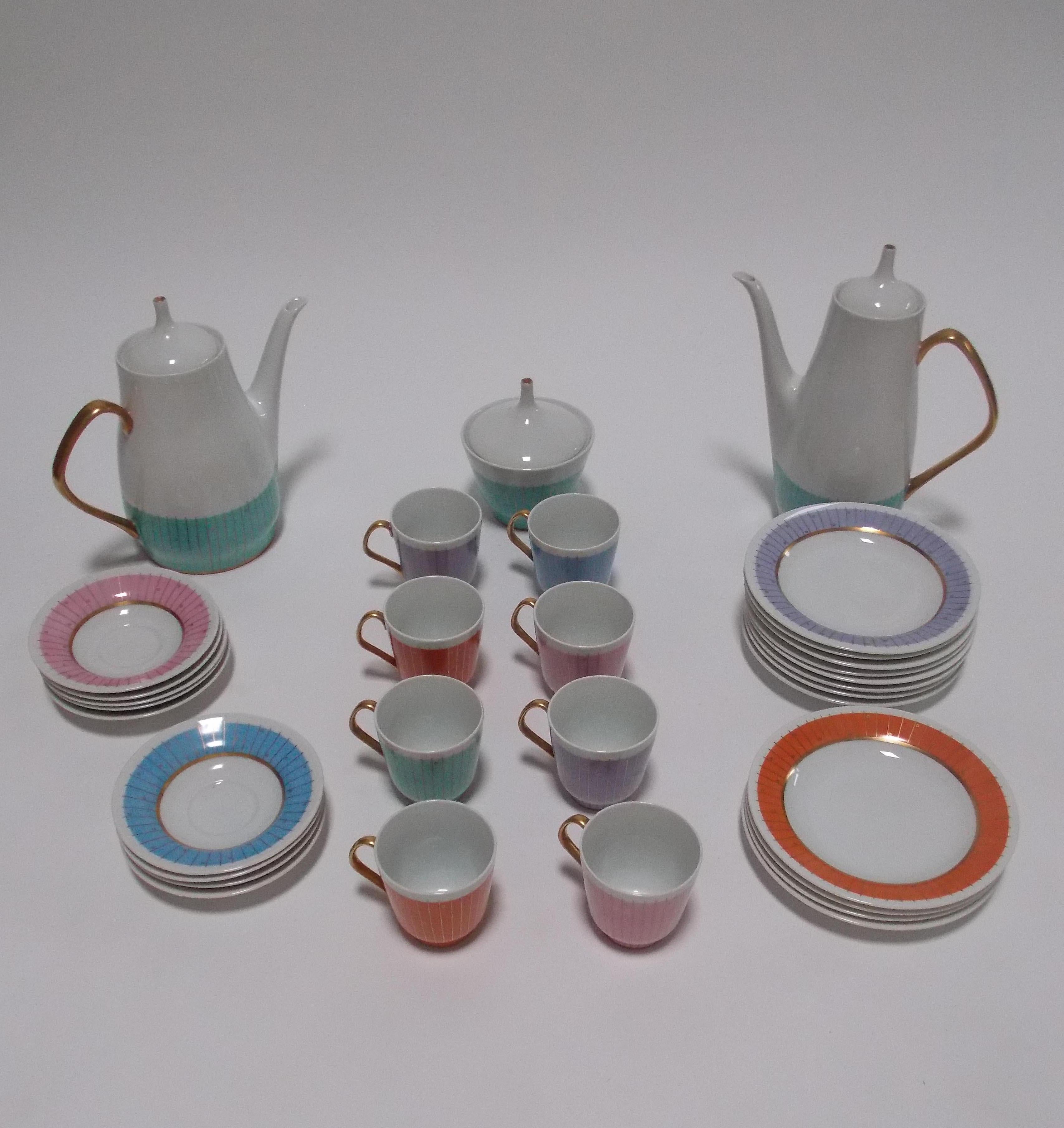 A complete coffee and tea set
consisting of a coffee and tea pot, sugar
Demitasse cups and saucers, cake plates.
Cups- 8 total 3