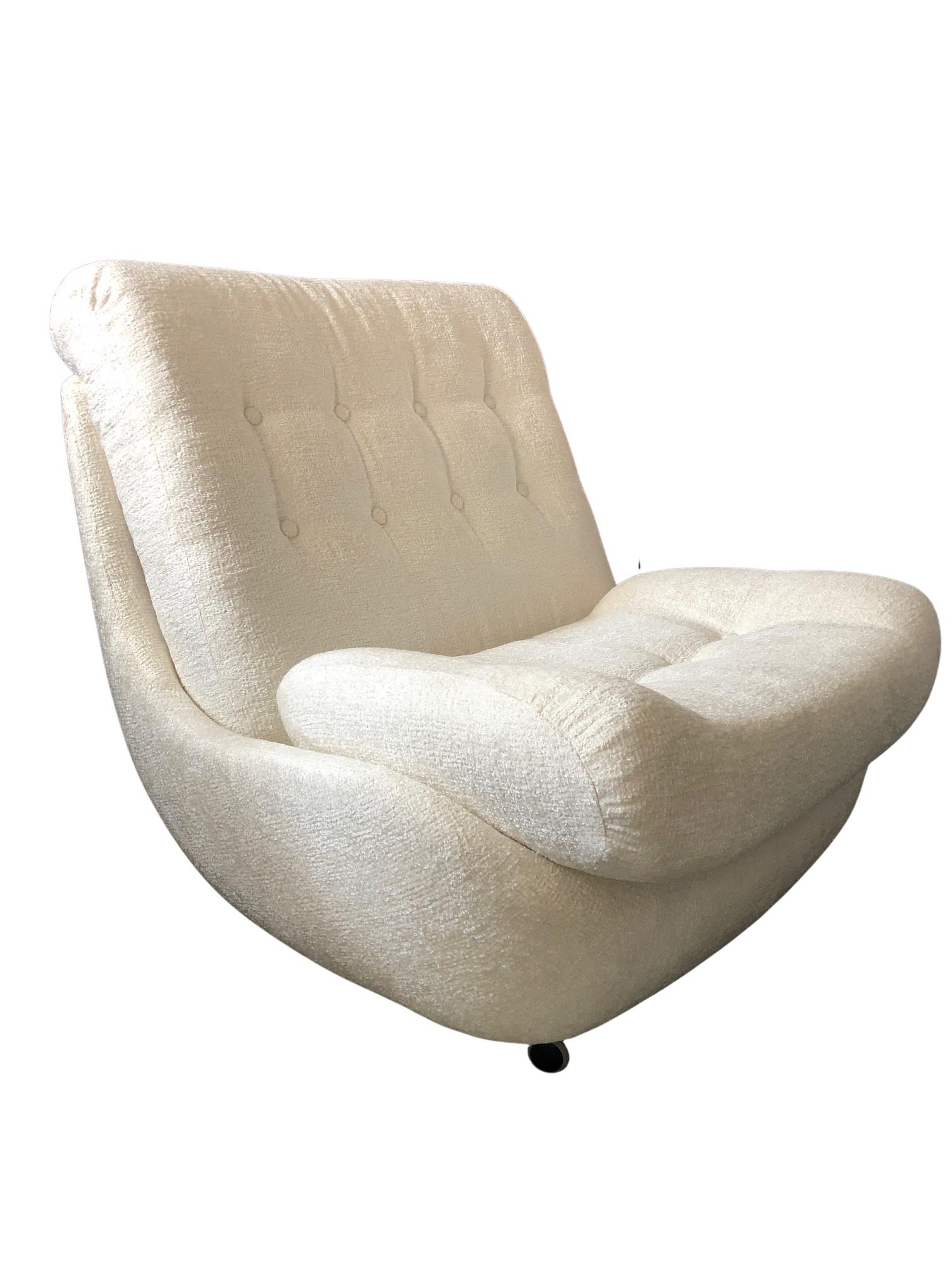 This rare Space Age armchairs set was produced in the 1960s in Czechoslovakia. They are big and extremely comfortable. The armchairs are made of reinforced polystyrene, thanks to which they are ultra-light. The upholstery is high quality boucle type