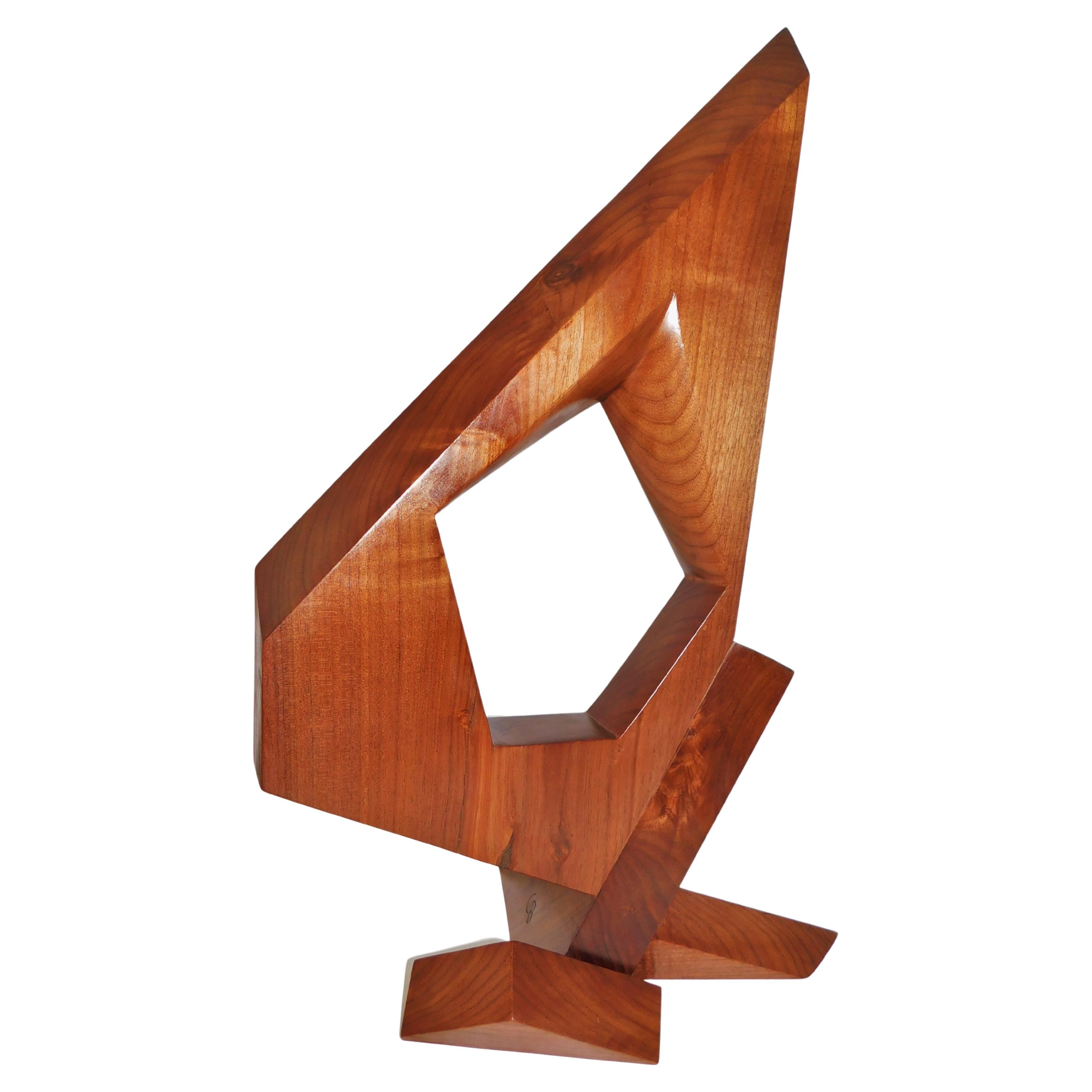 This contemporary abstract wooden sculpture is by Czeslaw Budny, a Polish-Canadian artist in the constructivist style circa 2023. This unique sculpture is made of recycled walnut. Budny utilizes the simplicity of shapes such as the cube, circle and