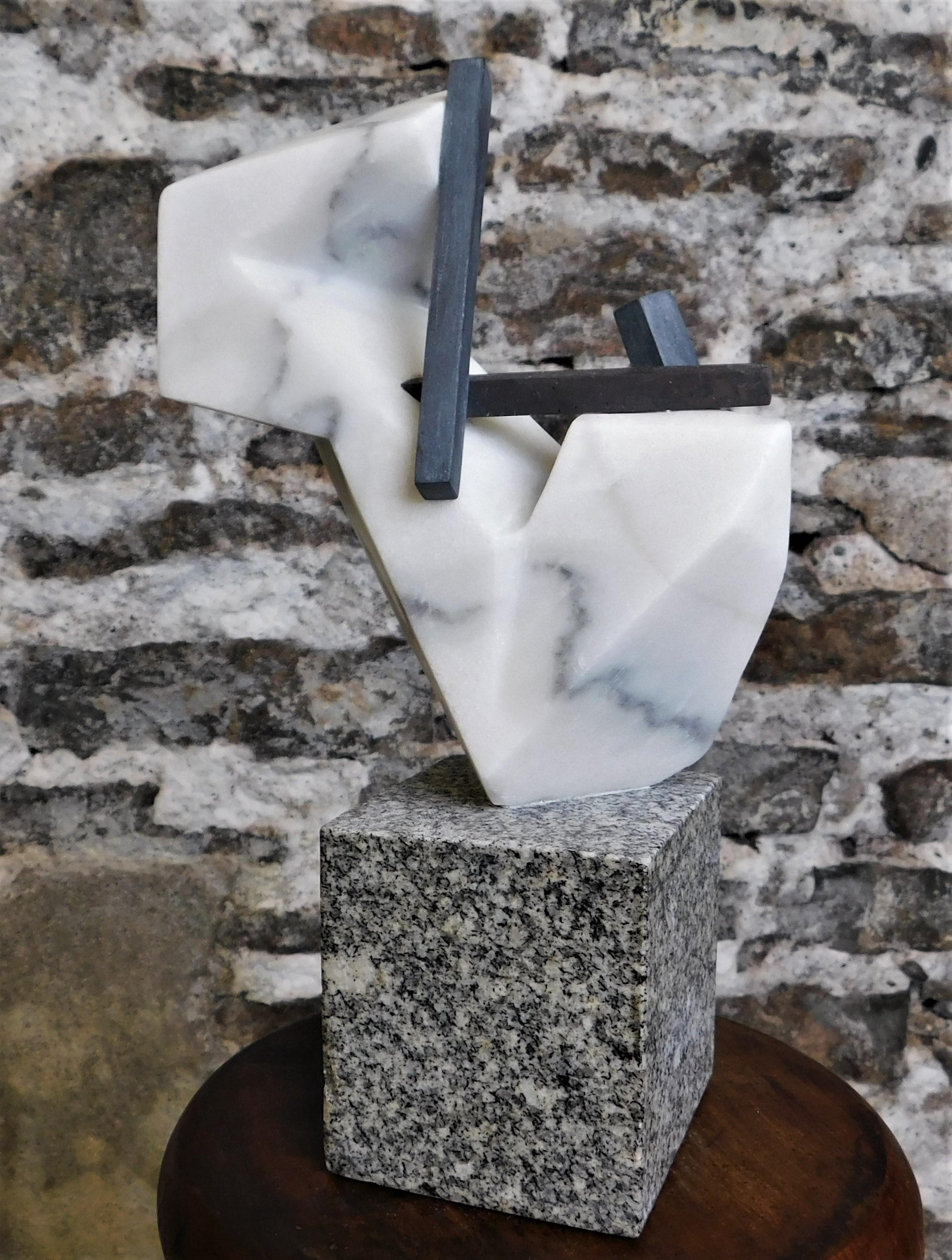 This contemporary abstract marble sculpture is by Czeslaw Budny, a Polish-Canadian artist in the constructivist style circa 2022. This unique sculpture is made of marble. Budny utilizes the simplicity of shapes such as the cube, circle and triangle