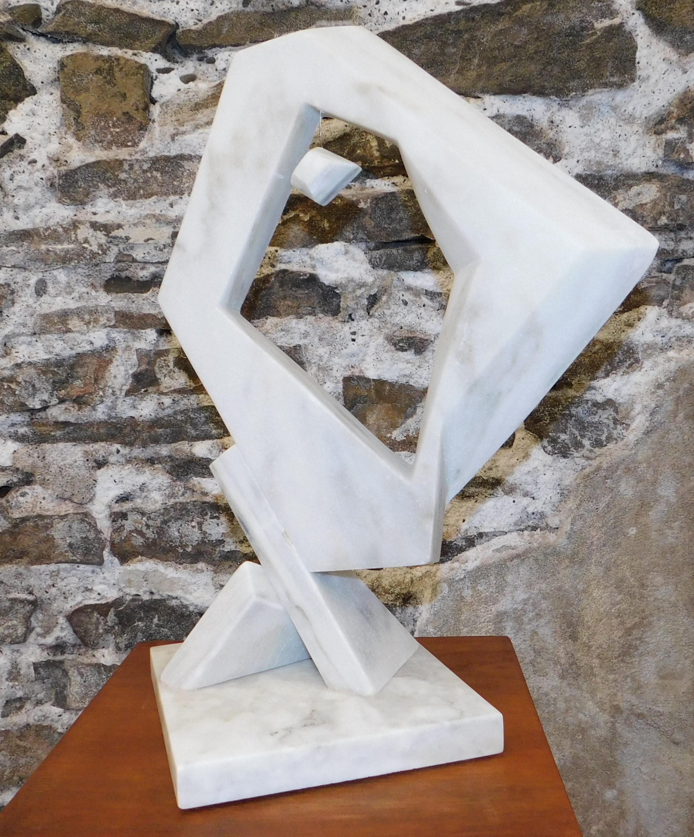 This contemporary abstract marble sculpture is by Czeslaw Budny, a Polish-Canadian artist in the constructivist style circa 2021. This unique sculpture is made of marble and has a floating marble stone in the middle on a marble base. Budny utilizes