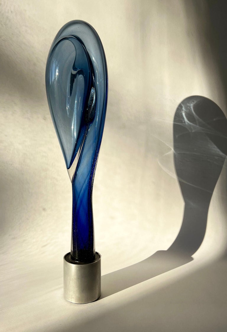 Hand blown glass sculpture attached to an aluminum base created by D.A. Johnson circa 1973. Sculpture measures 21