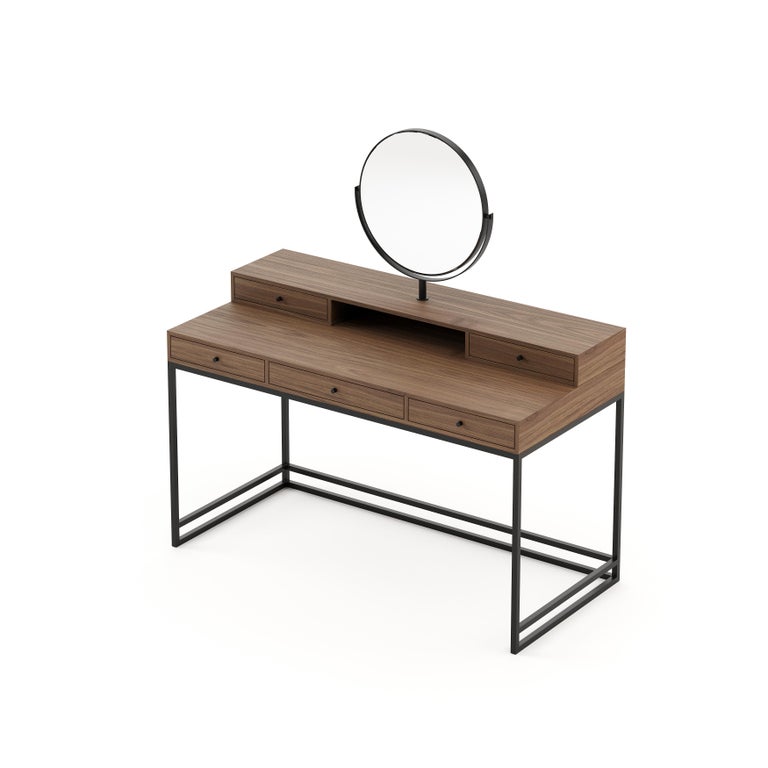 D’Arc dressing table features five drawers, one round mirror and a large surface area to make sure you will have everything in hand for your beauty routine. Built-in smooth wood and striking metal, this is the perfect piece for a feminine bedroom