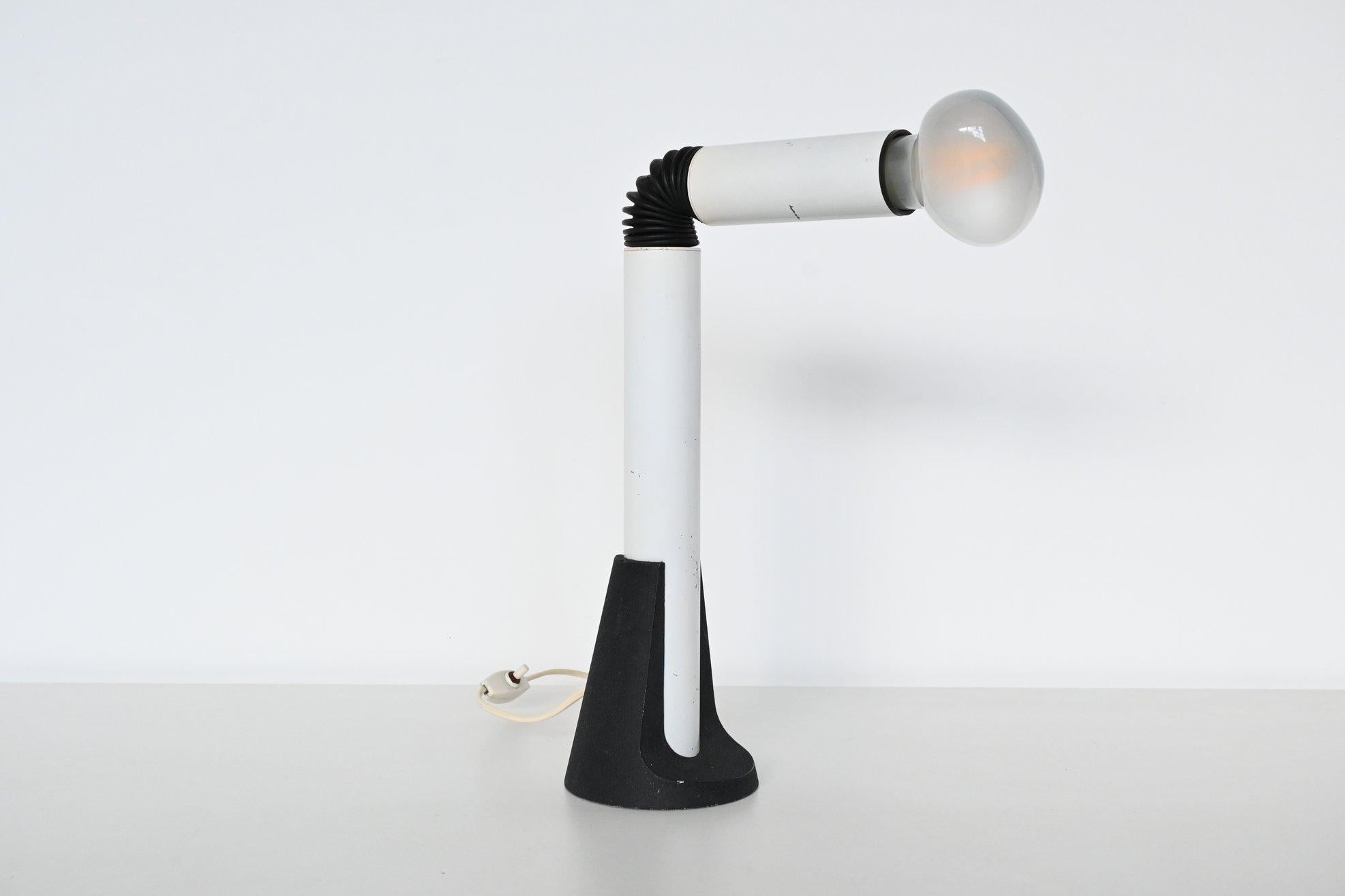 Very nice Periscopio table lamp designed by Danilo Aroldi & Corrado Aroldi and manufactured by Stilnovo, Italy 1967. The lamp has two white lacquered aluminium tubes connected with a rubber flexible joint supported by a round cast iron base. Because