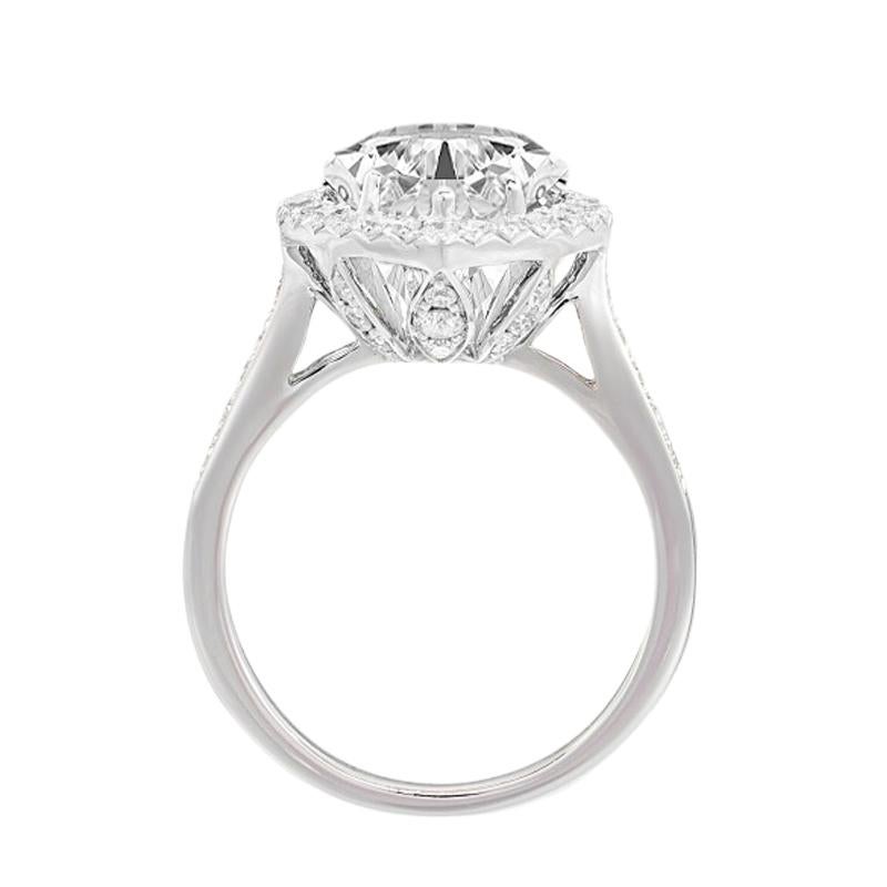 Contemporary GIA Certified 5.03 Carat Pear Cut F Color IF Clarity Diamond Ring with Halo For Sale