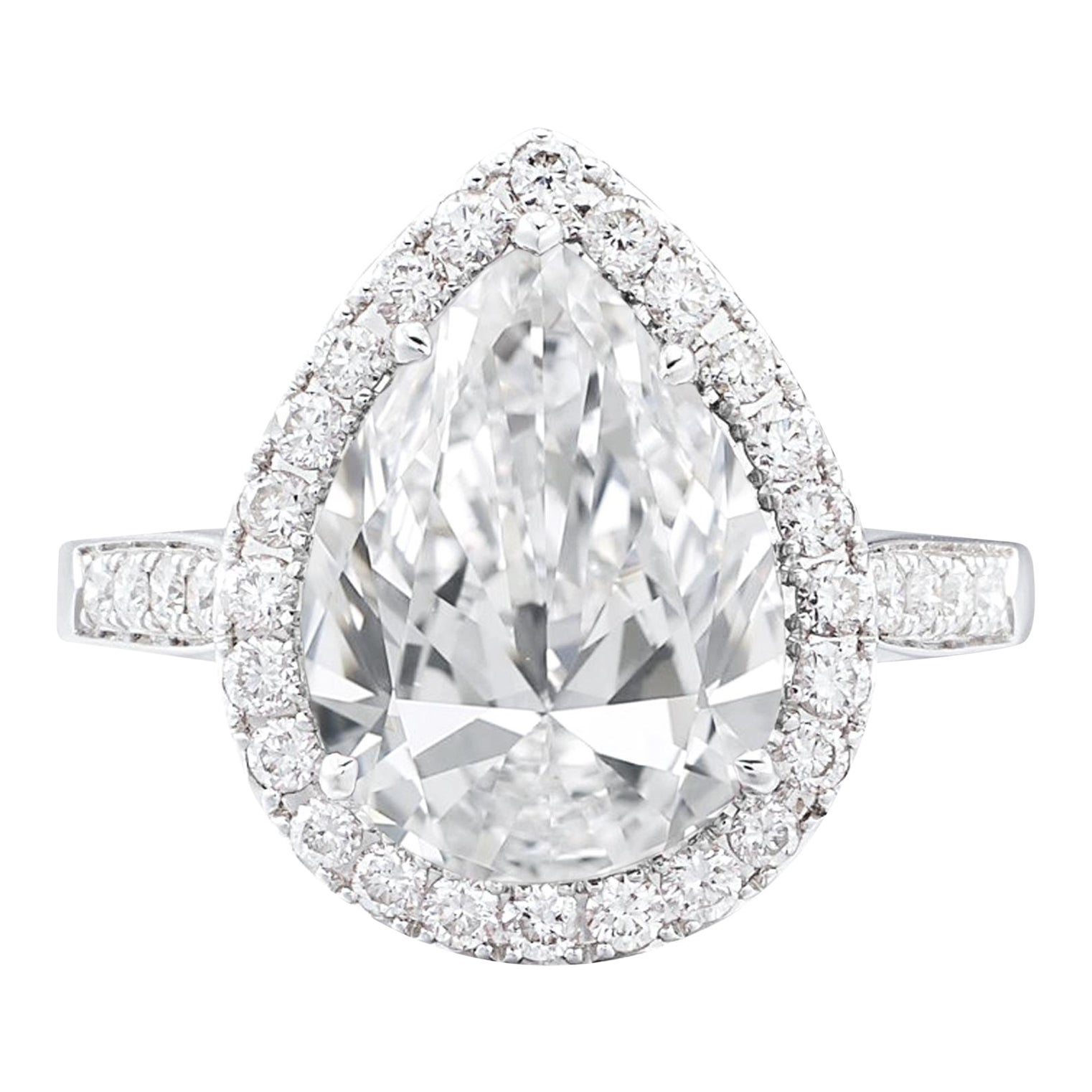 GIA Certified 5.03 Carat Pear Cut F Color IF Clarity Diamond Ring with Halo For Sale