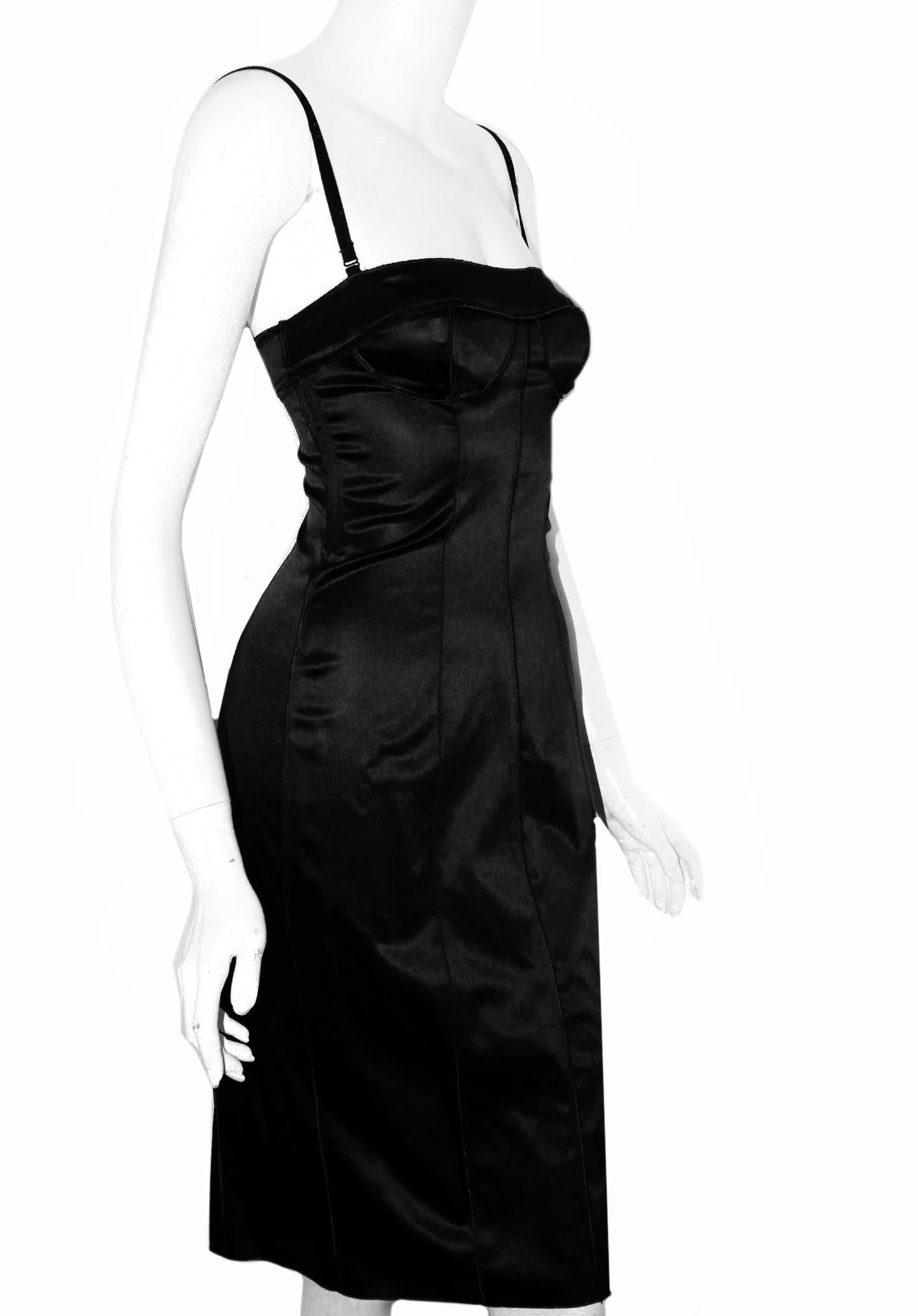 D & G  sexy black dress is Dolce & Gabbana through and through with its structured body and curve seams.  Constructed in form fitting midi style with added spandex for comfortable wear.  This spaghetti strap dress includes a back exposed zipper in
