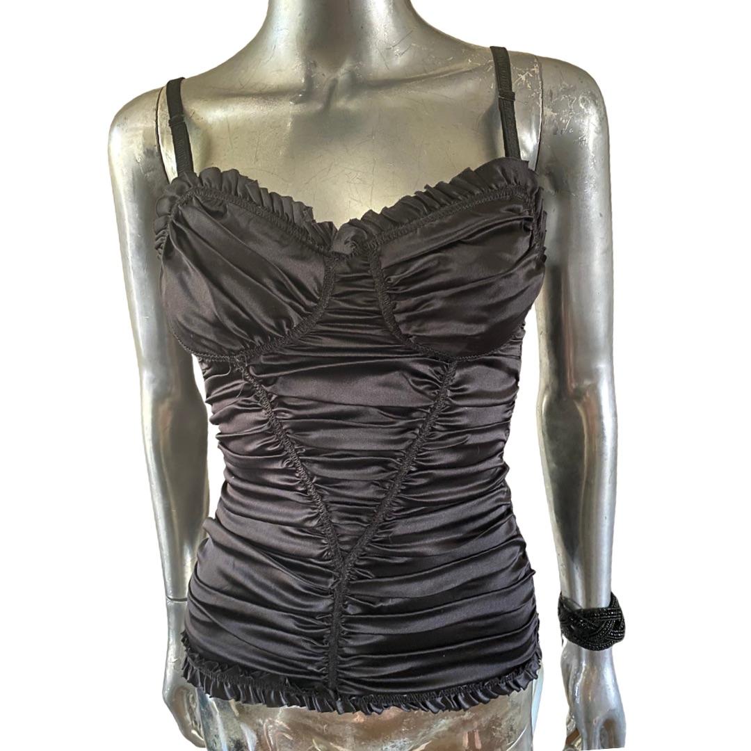Dolce and Gabbana have become famous for their vintage Italian lingerie looking items to be worn as day and evening designer clothes. This black silk bustiers is exactly that. Very sexy all completely ruched bustier as blouse, obtains the famous