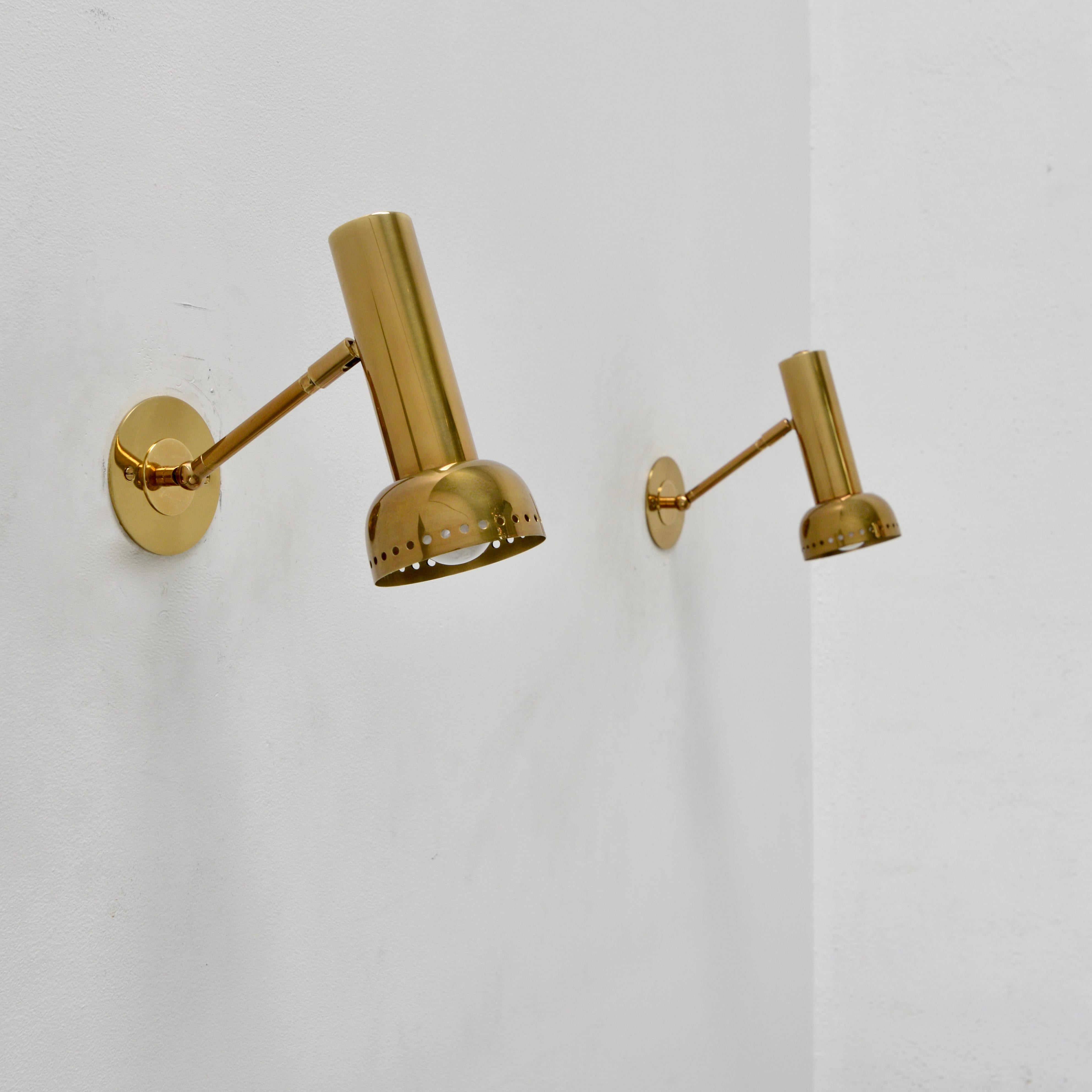 Handsome brass D-LU Sconce. An all brass Directional wall sconce in light gold brass with perforations by Lumfardo Luminaires. Made contemporary in the US. Multiples available for order. Can be wired for use anywhere in the world. Option for switch