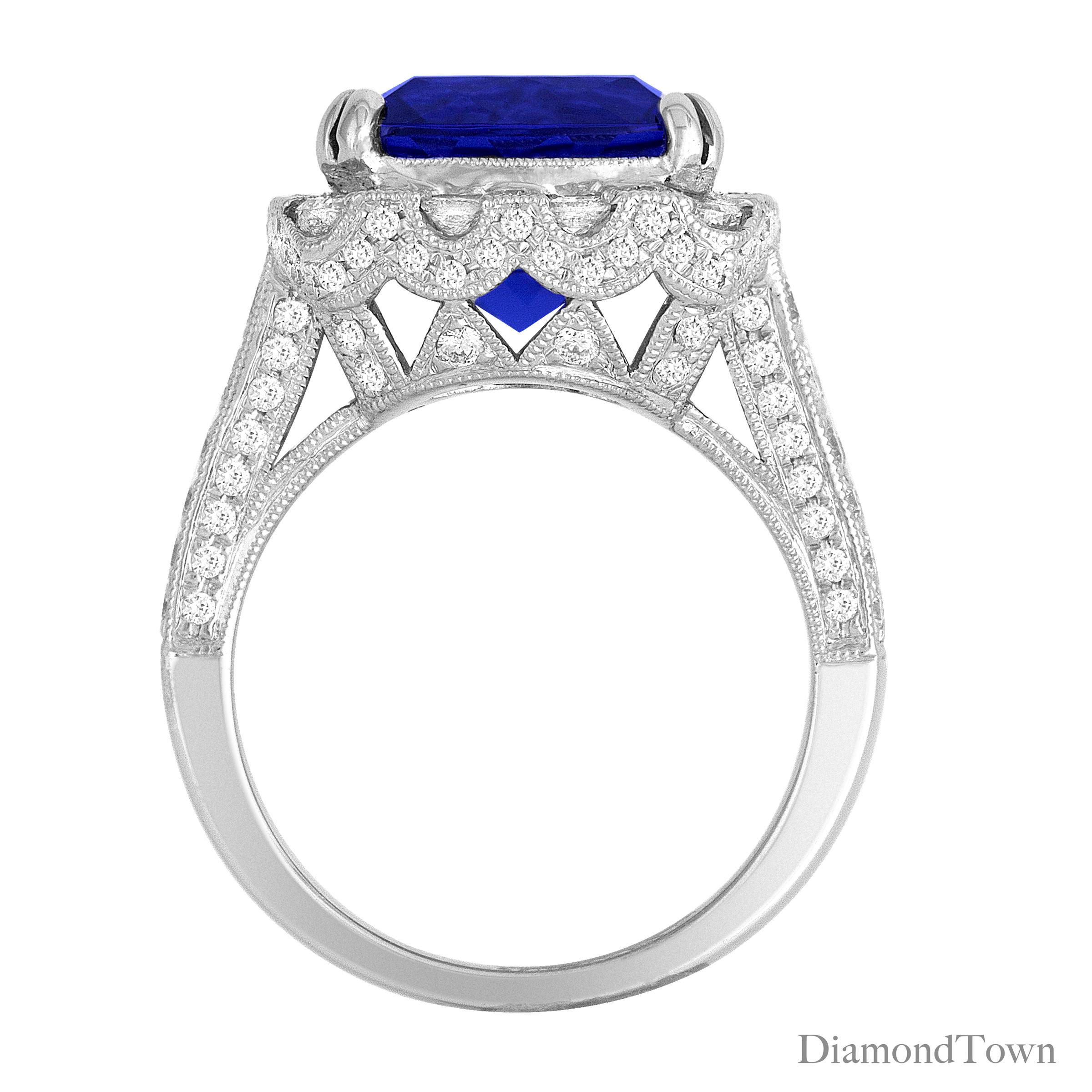(DiamondTown) This gorgeous ring has an Cushion Cut Tanzanite center measuring 6.99 carats, surrounded by a halo of round white diamonds. Additional diamonds decorate the side shank.

Center: 6.99 Carat Tanzanite Cushion
Halo:  8 Princess and 8