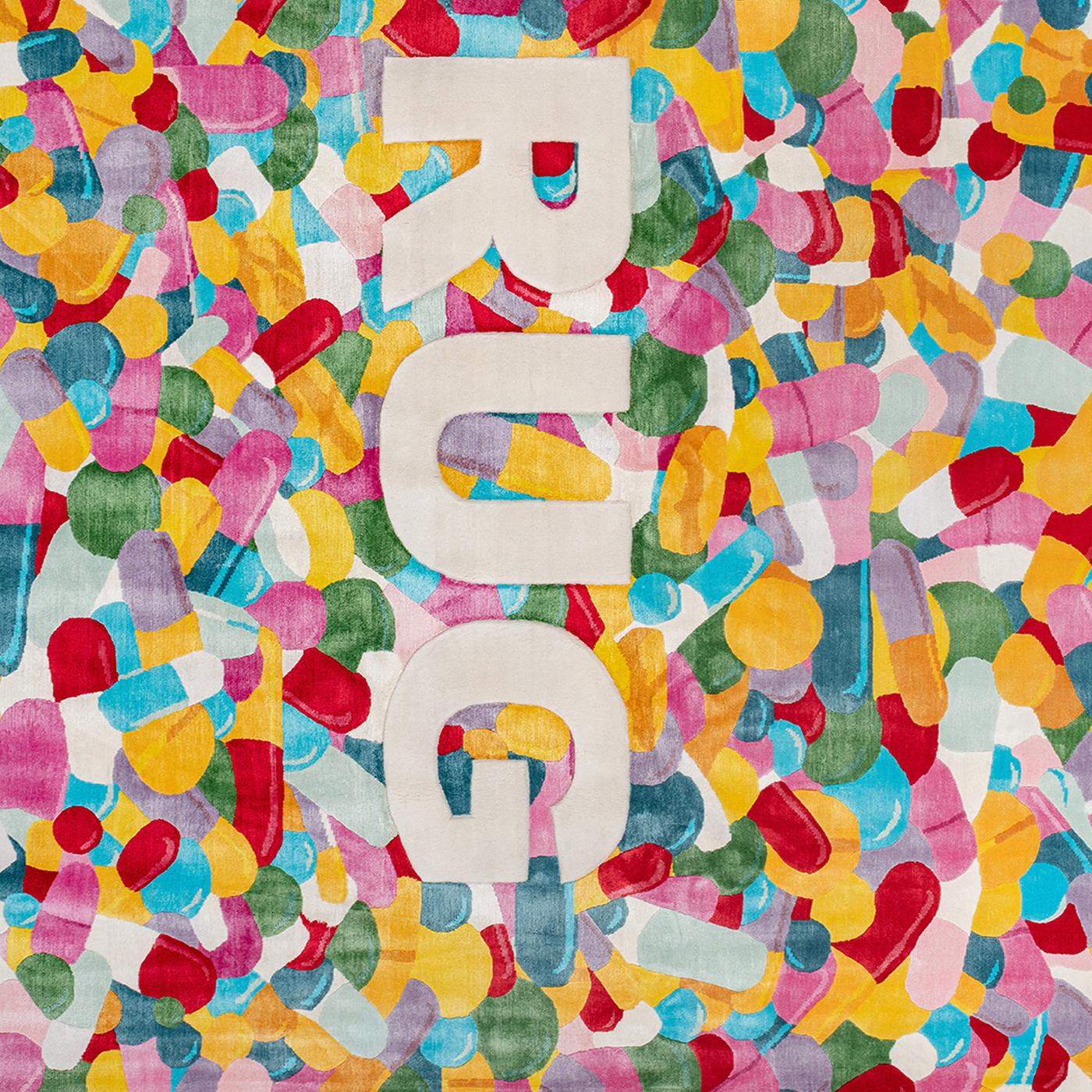 As provocative as it is visually impactful, this rug was handcrafted by Nepalese weavers from 50% silk and 50% Himalayan wool. The blasting design (H .07cm) of colorful capsule pills graphically enhances the DRUG lettering, where the D is rendered