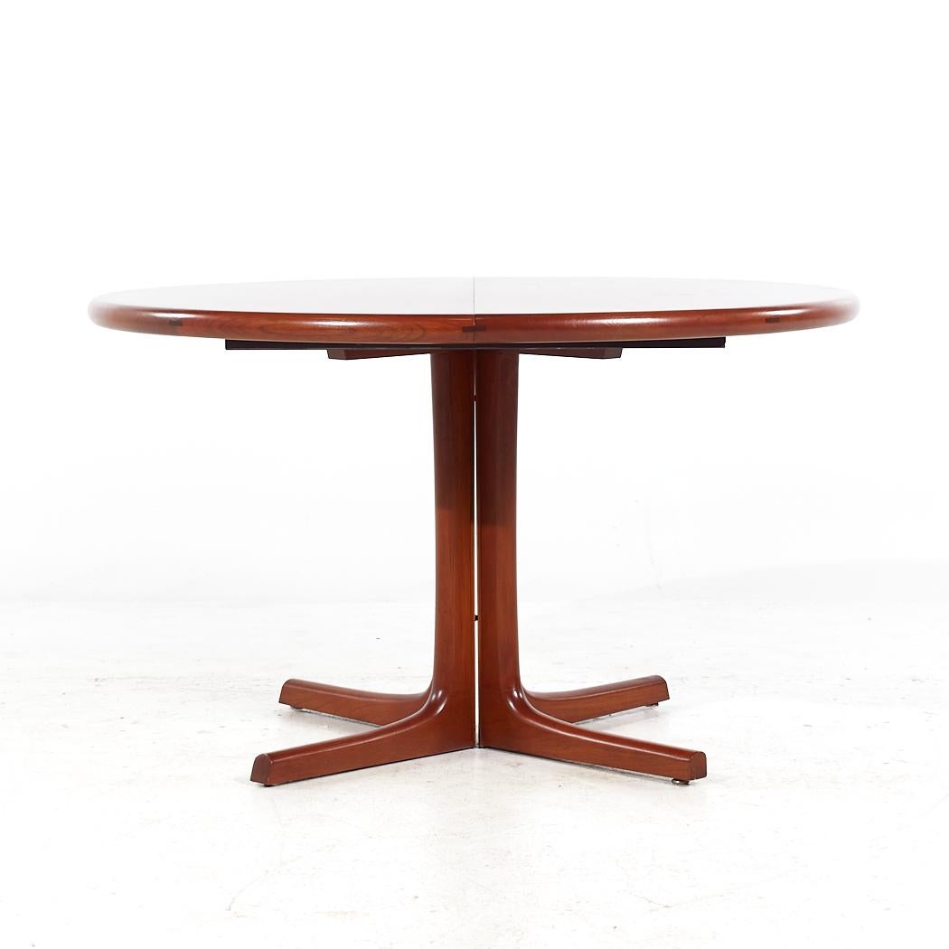 D-Scan Mid Century Teak Expanding Dining Table with 2 Leaves

This table measures: 47.75 wide x 48 deep x 28.25 inches high, with a chair clearance of 26.5 inches, each leaf measures 19.75 inches wide, making a maximum table width of 87.25 inches