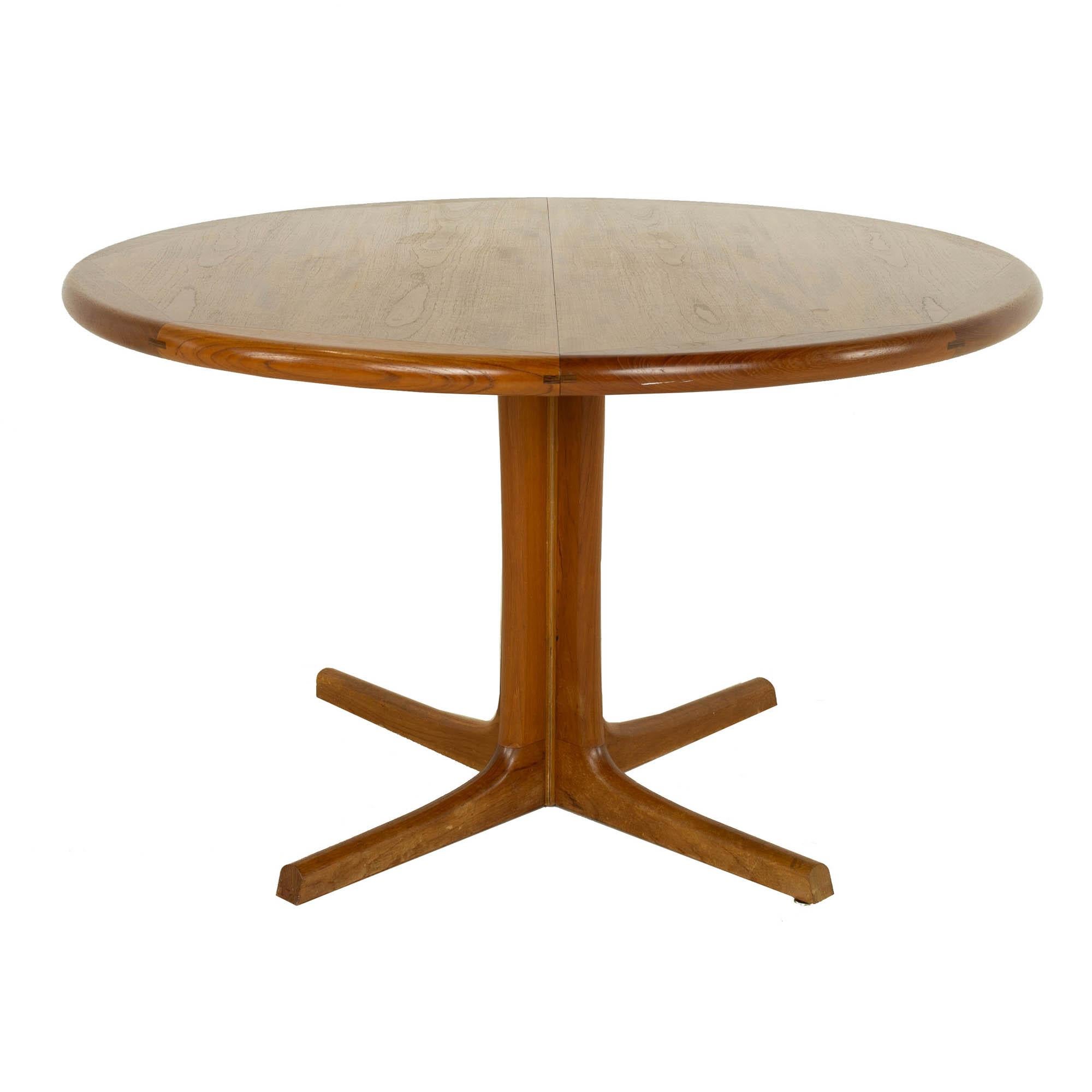 D-Scan mid century teak round dining table - 2 leaves

This table measures: 47.75 wide x 47.75 deep x 28.5 inches high, with a chair clearance of 26.75 inches, each leaf is 19.75 wide making the table 87.25 inches wide

?All pieces of furniture