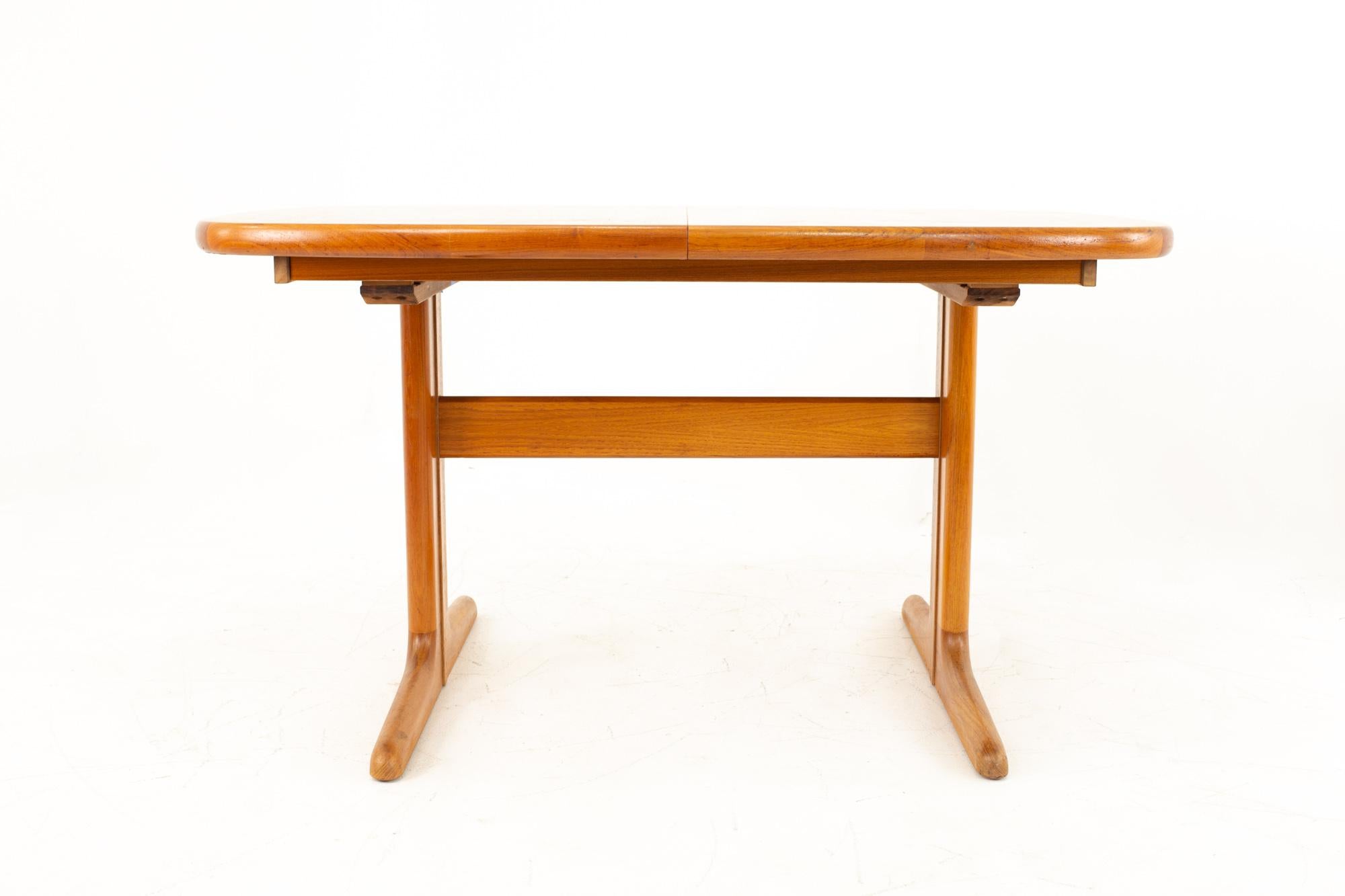 D-Scan midcentury teak table

Table measures: 53 wide x 35 deep x 29 high; Table with leaves: 73 wide x 35 deep X 29 high 

This price includes getting this piece in what we call restored vintage condition. That means the piece is permanently