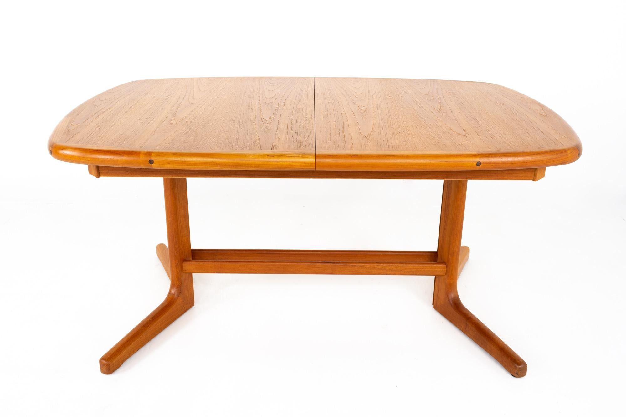 D-Scan Mid Century teak hidden leaf dining table
Table measures: 58.75 wide x 38.25 deep x 28 high
Table with leaf measures: 97 inches wide and leaf alone measures 38.25 inches wide 

This piece is available in what we call restored vintage