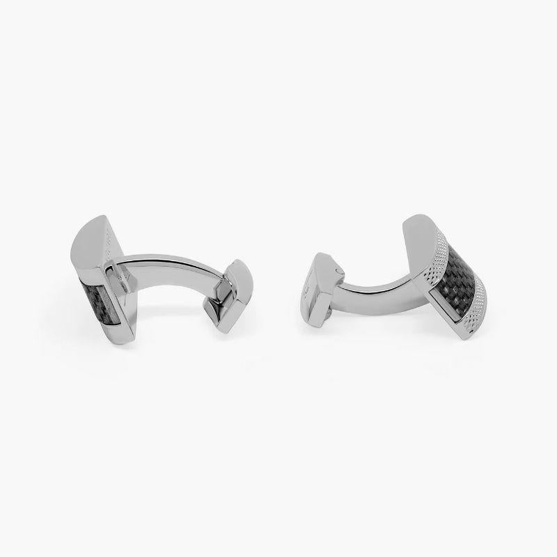 D Shape cufflinks with black carbon fibre in stainless steel

Our timeless D-shaped frame features an inlaid panel of genuine black carbon fibre, with our signature diamond pattern engraved around the face of each cufflink. Designed to be fun,