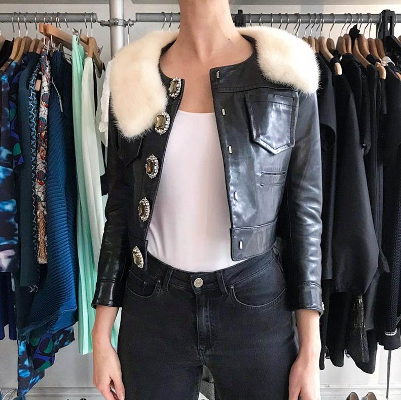 D Squared Black Leather Jewelled Button Crop Jacket with Mink Collar.  Short black leather jacket with ¾ bracelet length sleeves, front chest pockets, heavily jewelled rhinestone buttons, white mink fur collar.  Lined with red and white vertical