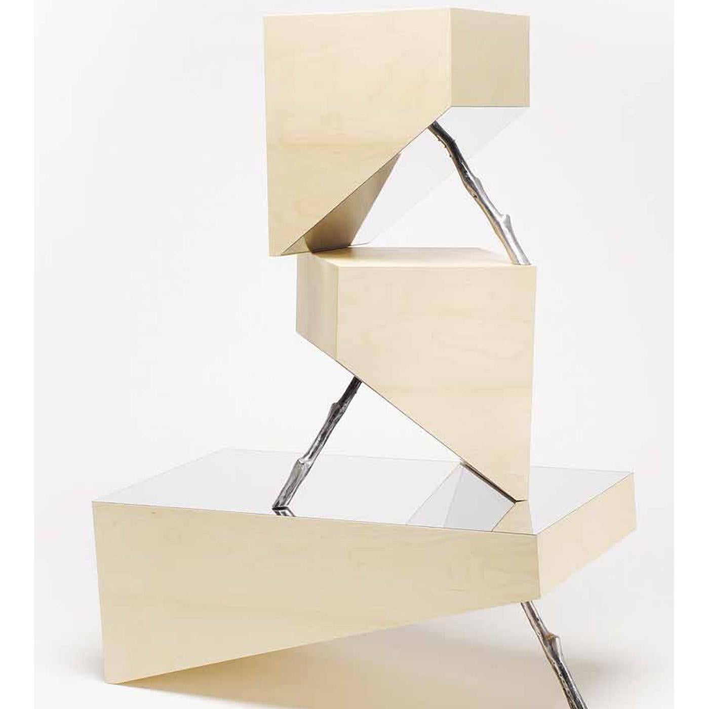 Inspired by the spiritual and physical balance of Zen practice, this captivating side table is marked by a bold geometric silhouette. The bamboo frame has a steel top with a mirror-polish finish and is supported by an aluminum stick in a seemingly