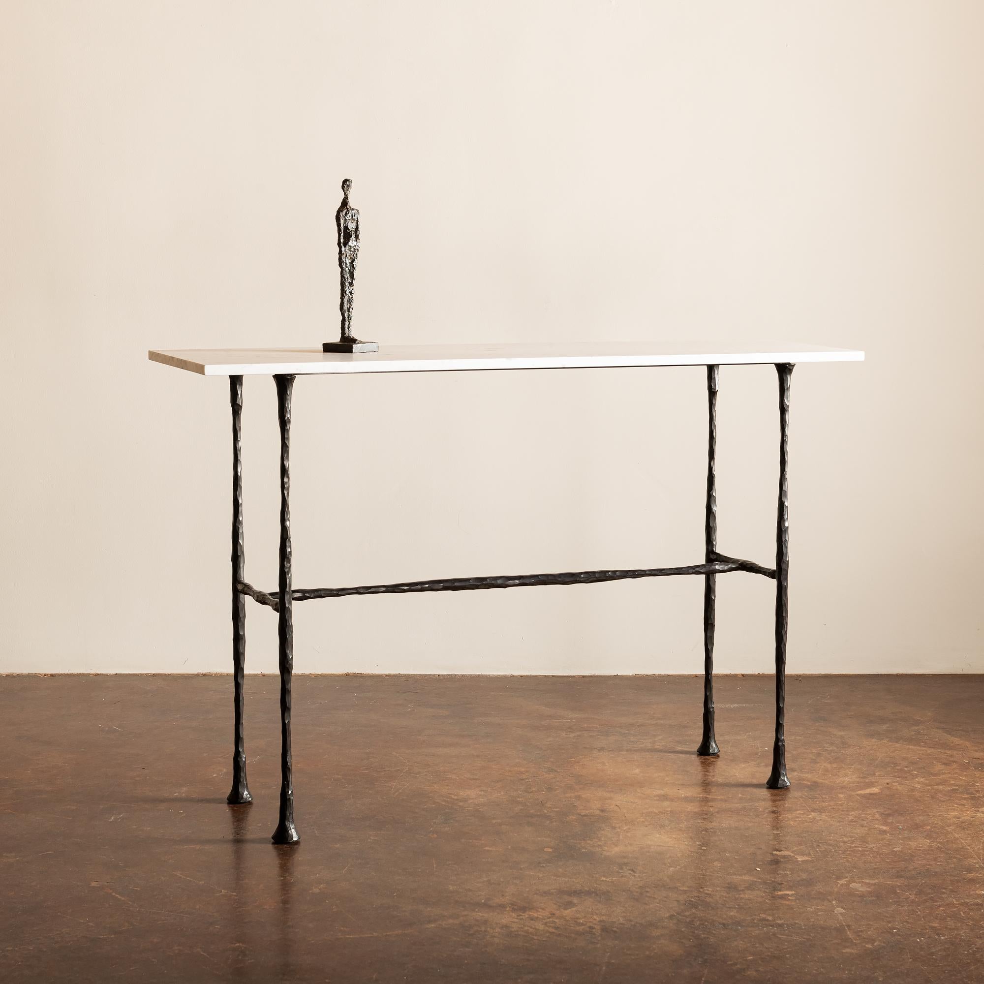 The DA Console table is inspired by the work of Diego and Alberto Giacometti and is executed in blackened bronze and Carrara marble. This piece is a collaboration between Lauren Hunt and Caleb Kullman, a talented blacksmith based in Santa Fe, NM.