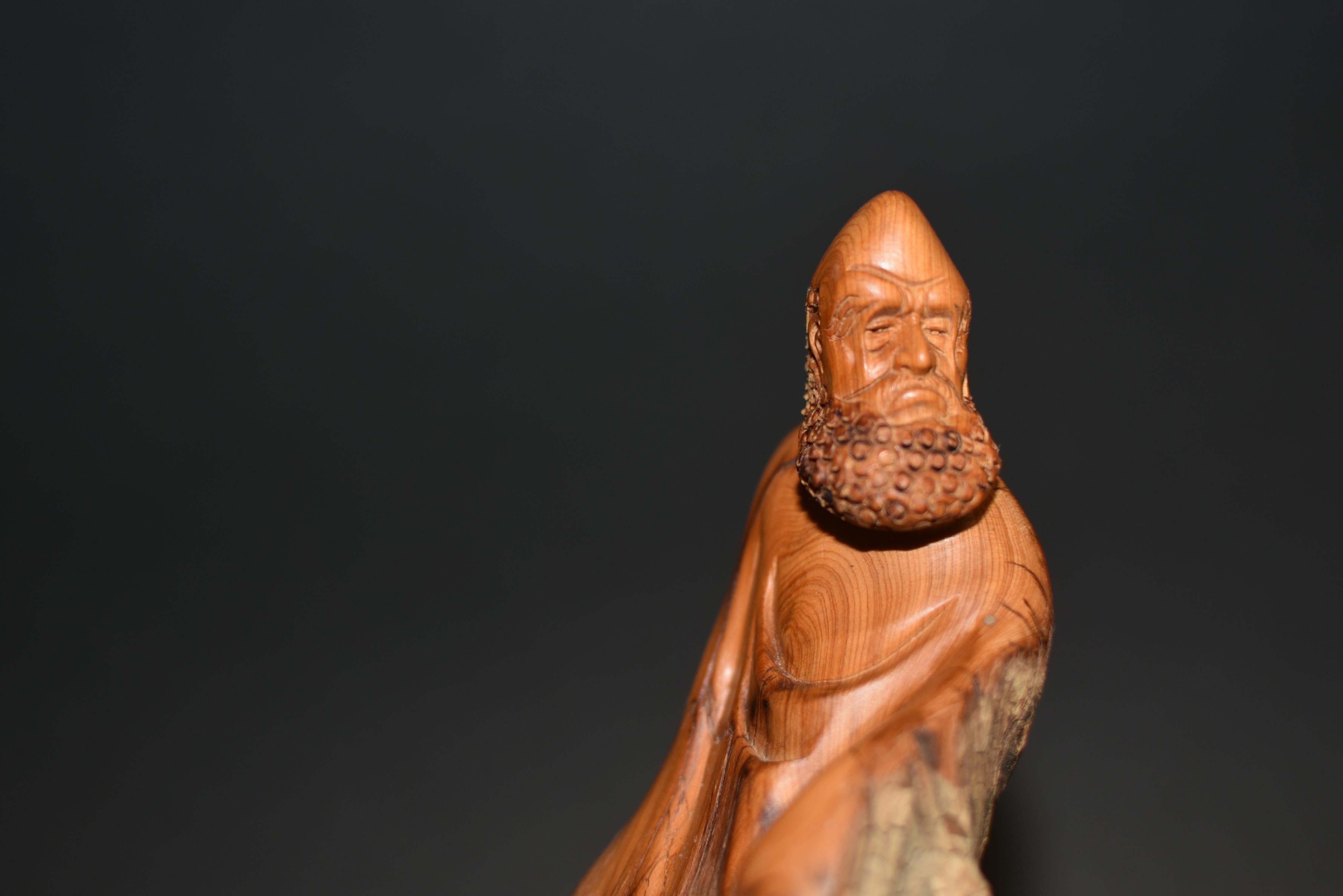 This is a very special statue of the Buddhist monk Bodhidharma (Damo). A legendary Buddhist monk who is believed to be the saint who introduced Buddhism to China, Damo represents 