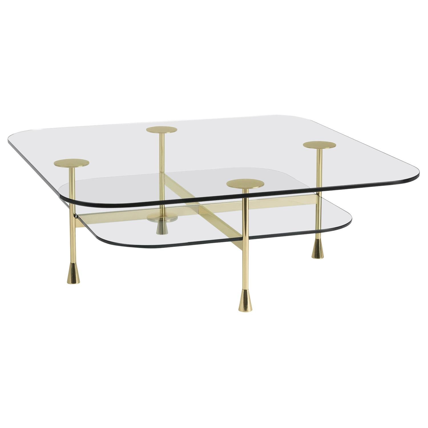 Part of the Da Vinci collection, this exquisite coffee table was introduced at Milan Design Week 2018. Its light and elegant silhouette is made of a brass structure that combines pure geometric elements with contrasting straight and round shapes to