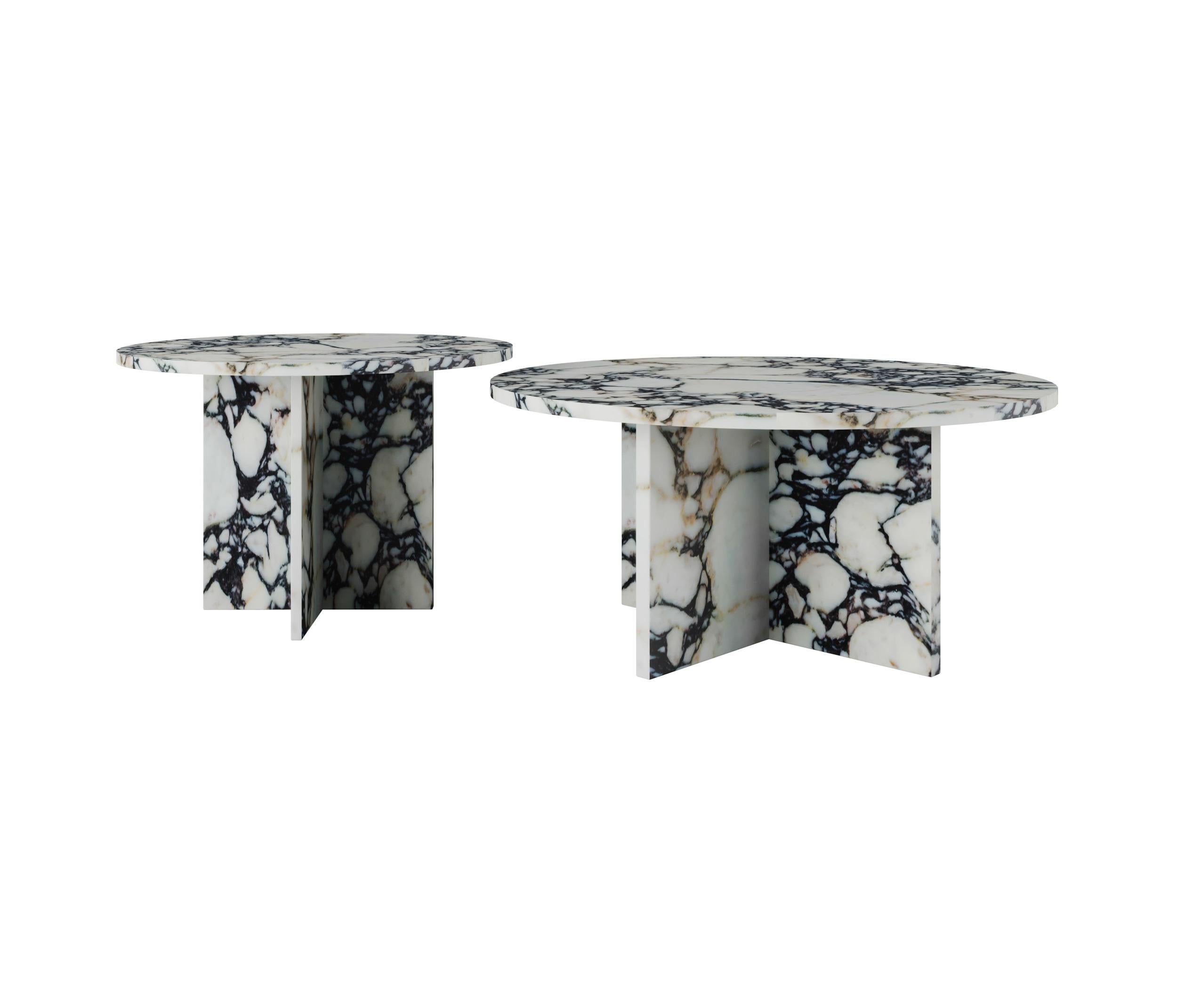 The Dabney Coffee Table features a lustrous marble surface that adds a touch of opulence to any space. The varying sizes allow for a nested arrangement, providing a dynamic visual appeal and adaptability to your changing needs. Whether serving as