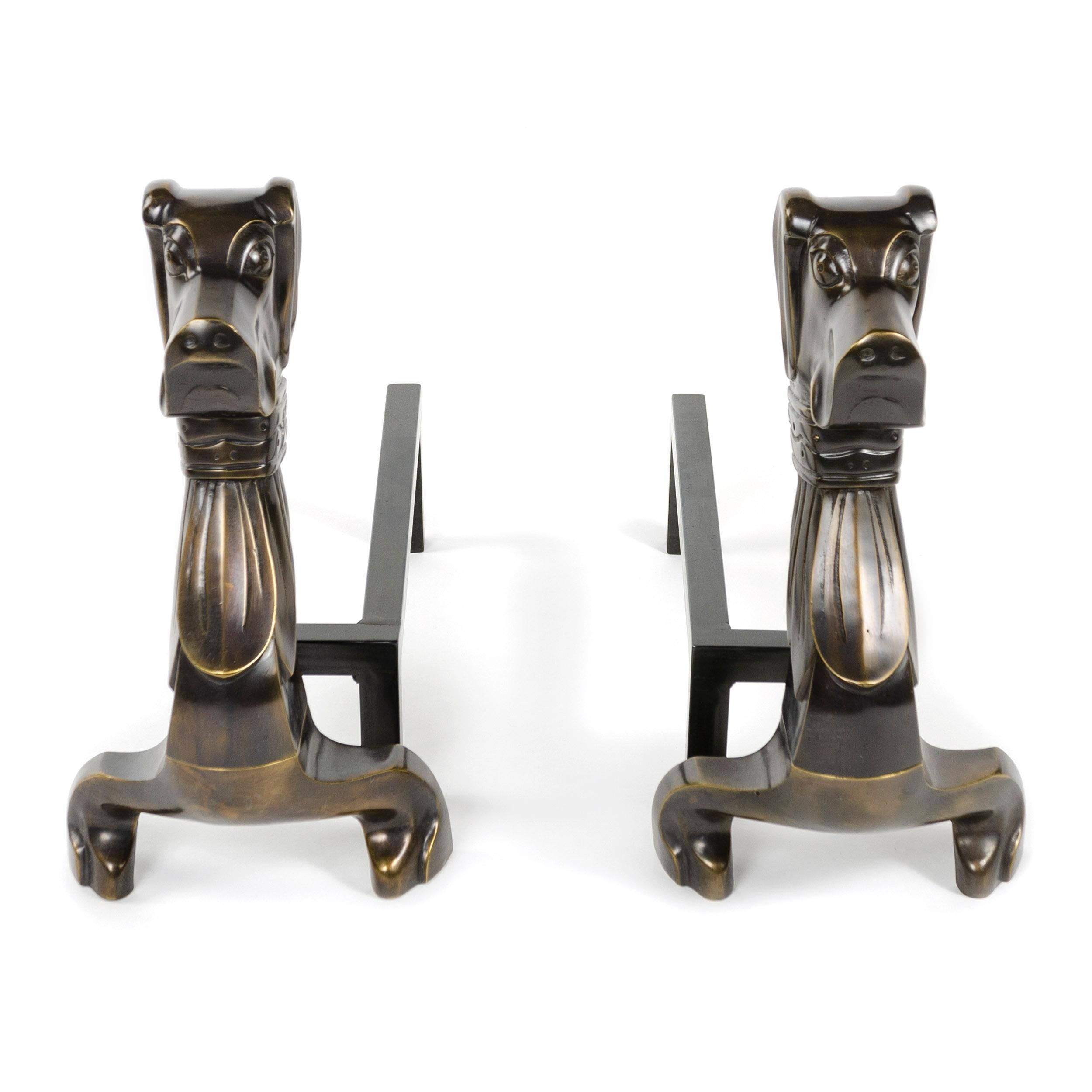 A substantial pair of Art Deco dachshund andirons in a patinated bronze finish.