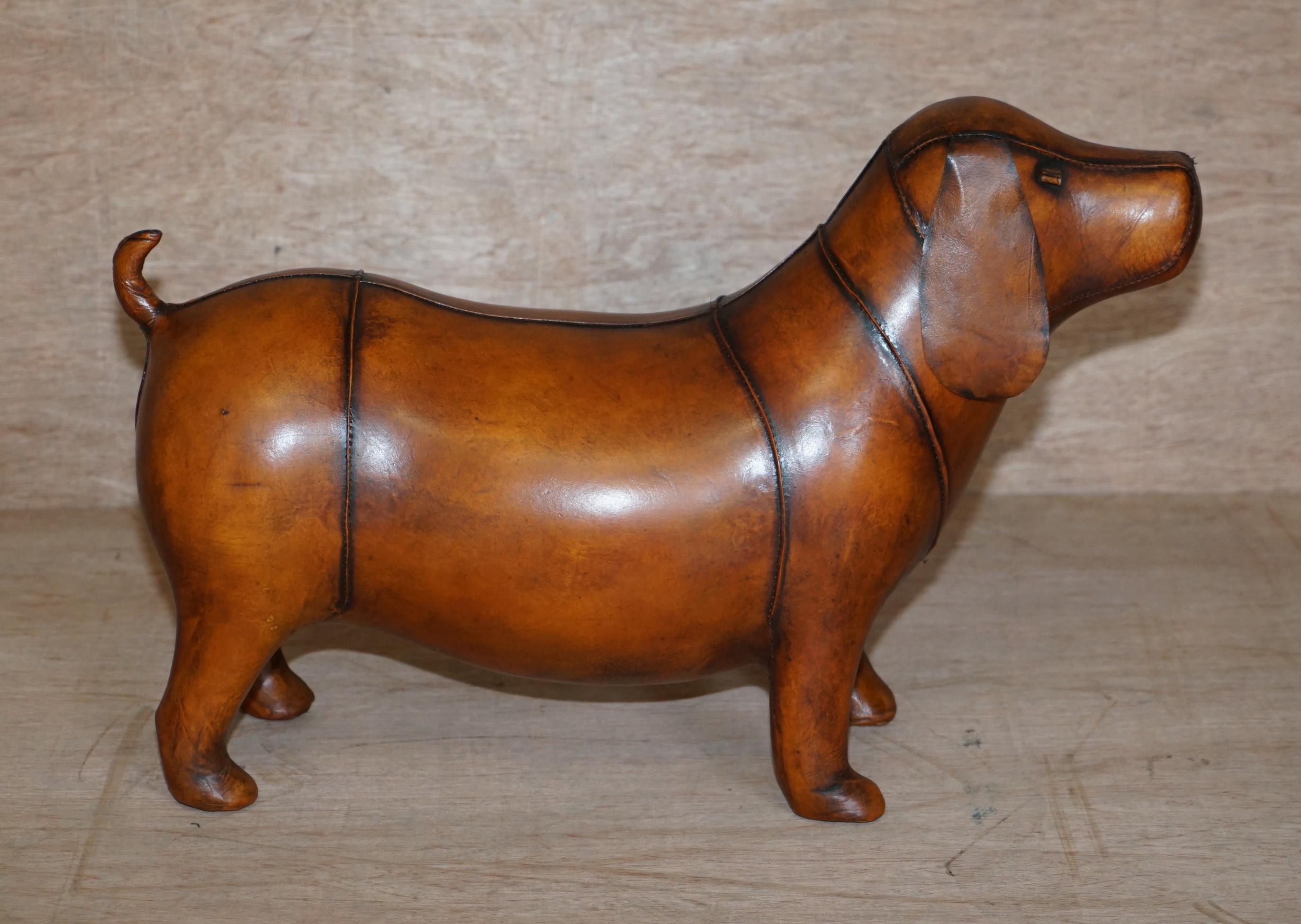 Royal House Antiques is delighted to this absolutely sublime new old stock original Liberty’s London Omersa style brown leather hand dyed Sausage dog Dachshund footstool

These come in varying sizes there is a quite unpractical extra large size