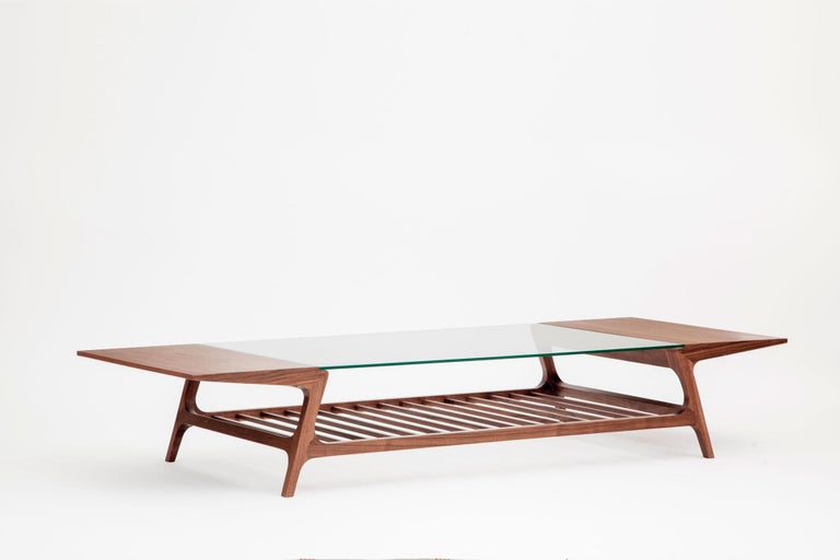 Inspired on traditional 50's designs but asserting itself with a craft aesthetic, the DADA coffee table has light and vivid lines.

A sophisticated addition to any interior space, the solid natural walnut frame of this versatile table adds warmth
