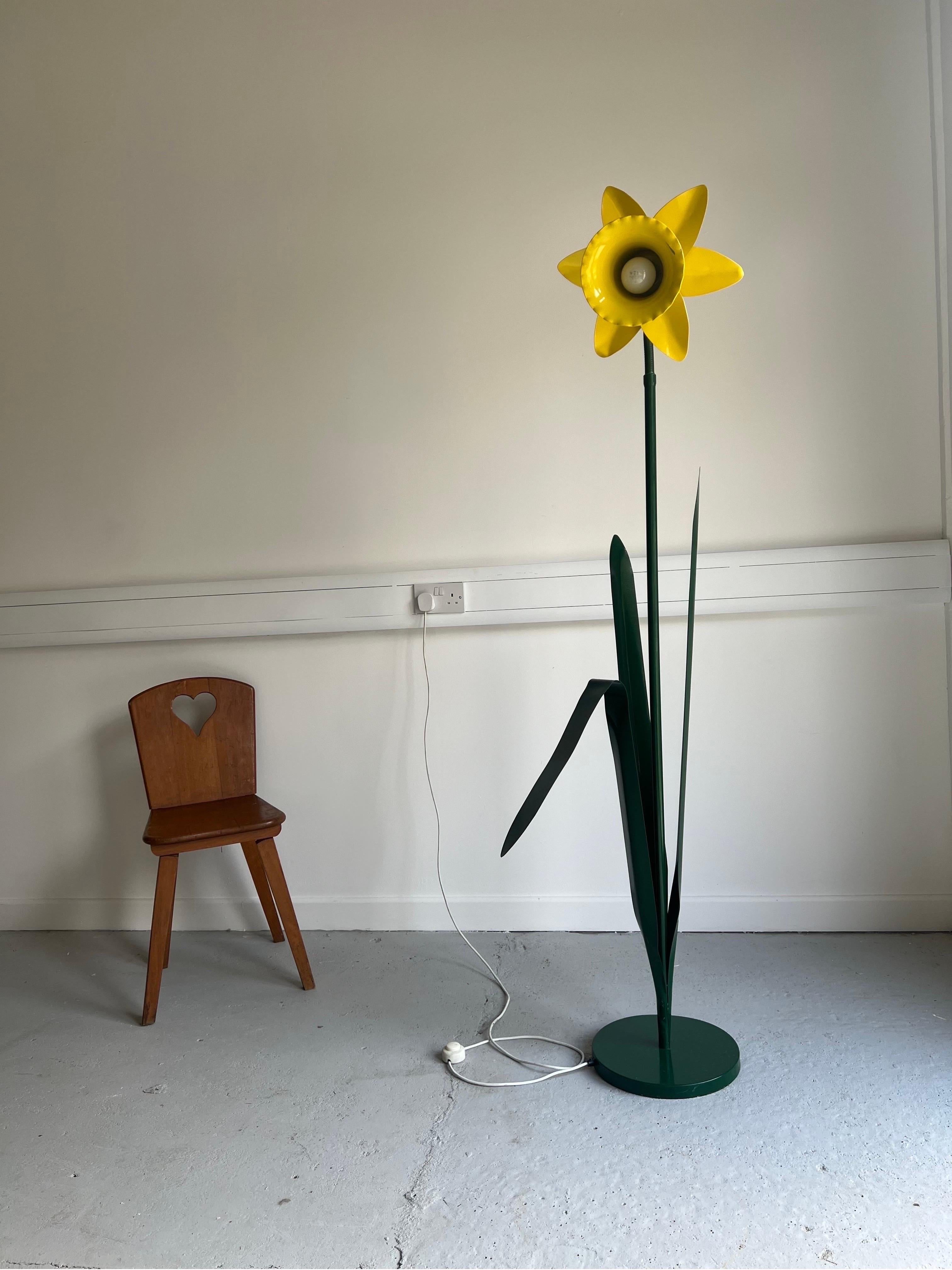 Peter Bliss Original Yellow Metal Daffodil Floor Lamp from 1986.  

Large, iconic and super rare bright yellow daffodil floor lamp made by Bliss. The neck is adjustable.  

In fair condition, there is some age related wear, a small paint chip on the