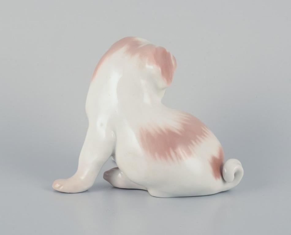Mid-20th Century Dahl Jensen for Bing & Grøndahl, porcelain figurine of a Pekingese puppy.  For Sale