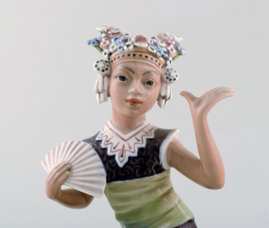 Dahl Jensen porcelain figurine. Aju Sitra. Model number 1322. 1st factory quality, 1920s-1930s.
In very good condition. 
Measures: 19 x 10.5 cm.
Signed: Kings crown, DJ Copenhagen.