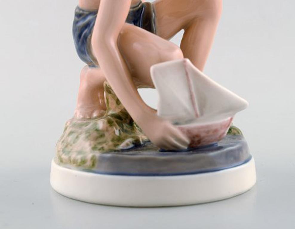 Dahl Jensen Porcelain Figurine, Boy with Boat, Model Number 1245 In Good Condition In Copenhagen, DK