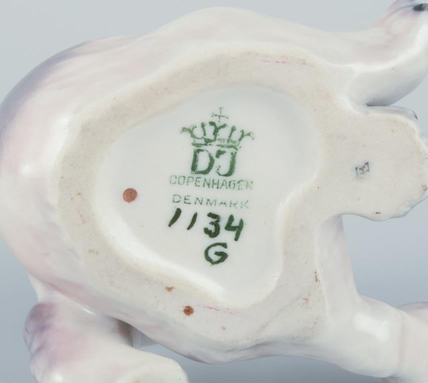 Mid-20th Century Dahl Jensen, porcelain figurine of a Pekingese puppy. For Sale