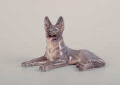 Dahl Jensen, porcelain figurine of a reclining German Shepherd.