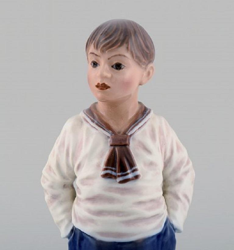 Dahl Jensen porcelain figurine. Sailor boy. Model number 1225. 
1920/30's.
In excellent condition. 
1st factory quality. 
Measures: 22,5 x 9,5 cm. 
Signed: King's crown, DJ Copenhagen.