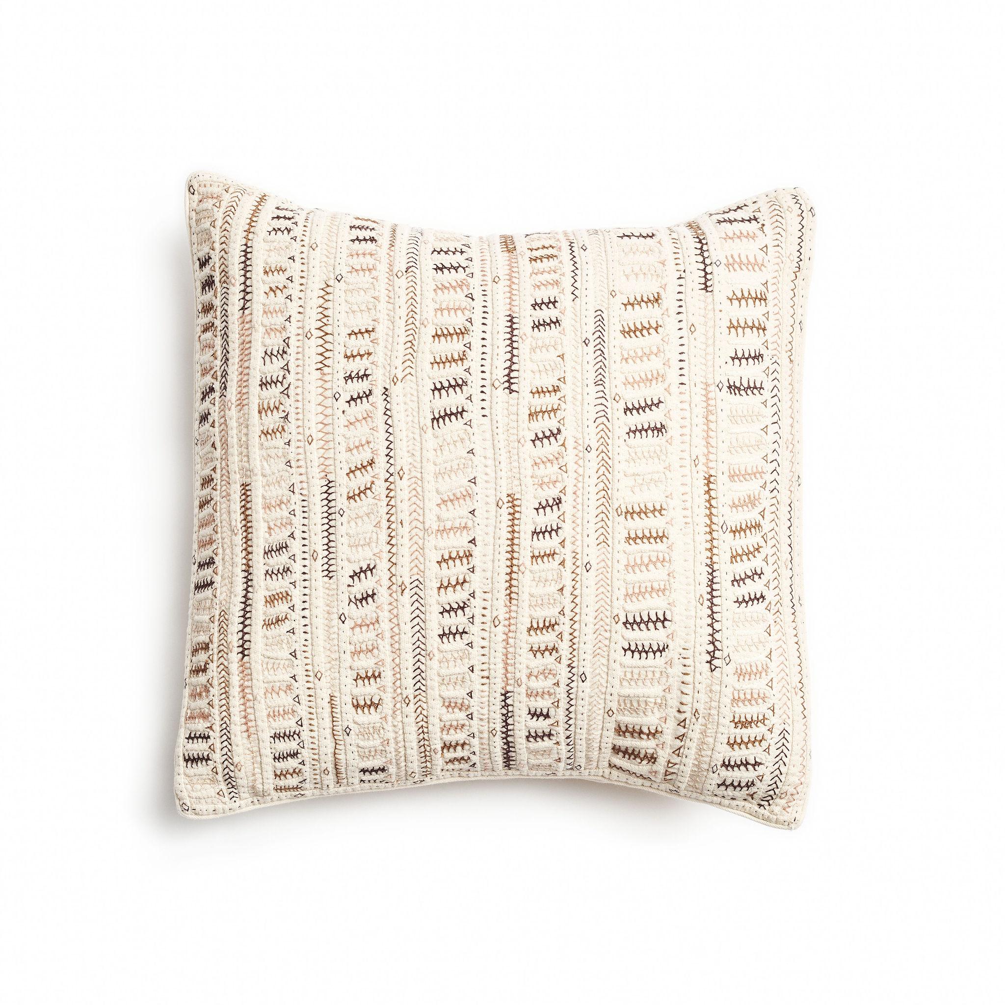 Dahli Brown is a fully embroidered pillow , with one of a kind beautiful handwork highlighting the borders in colorful tones and textural techniques.  Behind this piece is a unique group of artisan women in India. This particular technique is unique