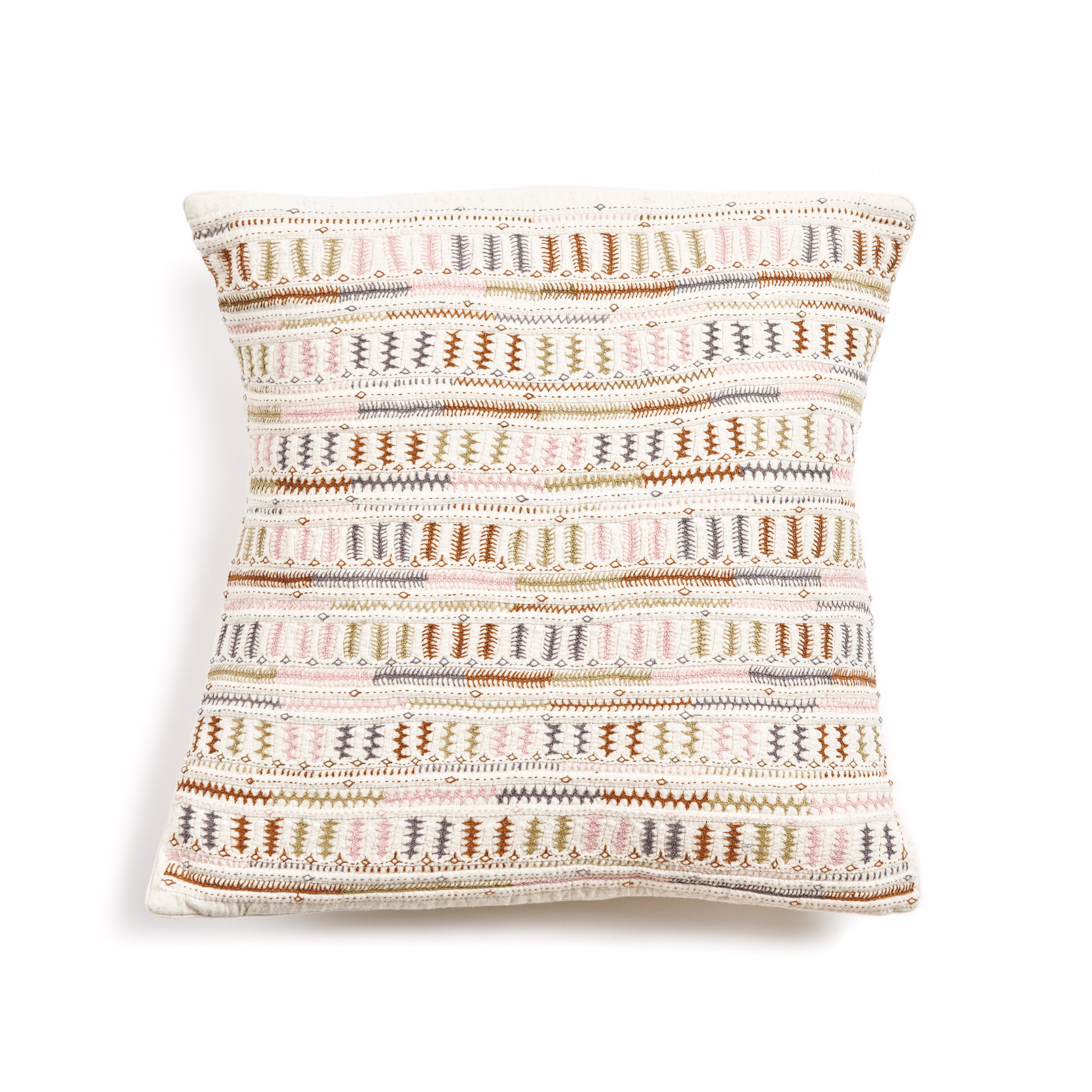 Dahli is a fully embroidered pillow , with one of a kind beautiful handwork highlighting the borders in colorful tones and textural techniques.  Behind this piece is a unique group of artisan women in India. This particular technique is unique only