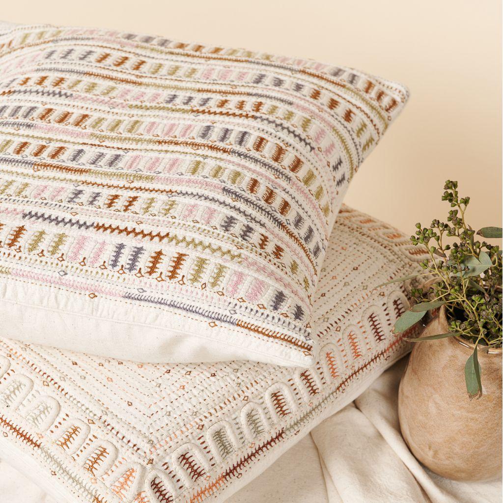 Dahli is a fully embroidered pillow , with one of a kind beautiful handwork highlighting the borders in colorful tones and textural techniques.  Behind this piece is a unique group of artisan women in India. This particular technique is unique only