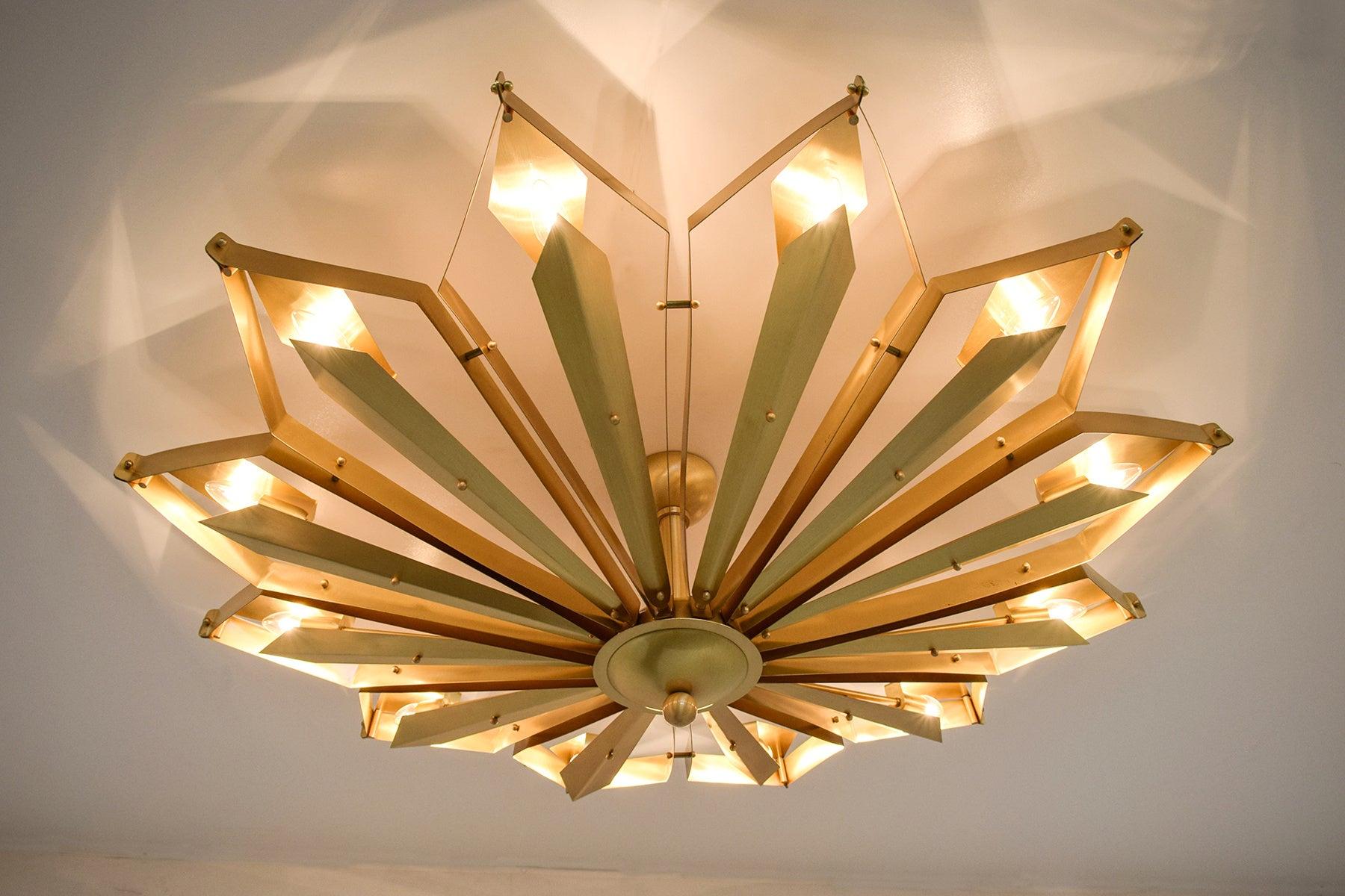 Elegant Italian flushmount with satin brass frame handcrafted to resemble a convex dahlia flower, designed by Fabio Bergomi for Fabio Ltd, made in Italy
12 lights / E12 or E14 type / max 40W each
Measures: Diameter 51 inches, height 16 inches
Order