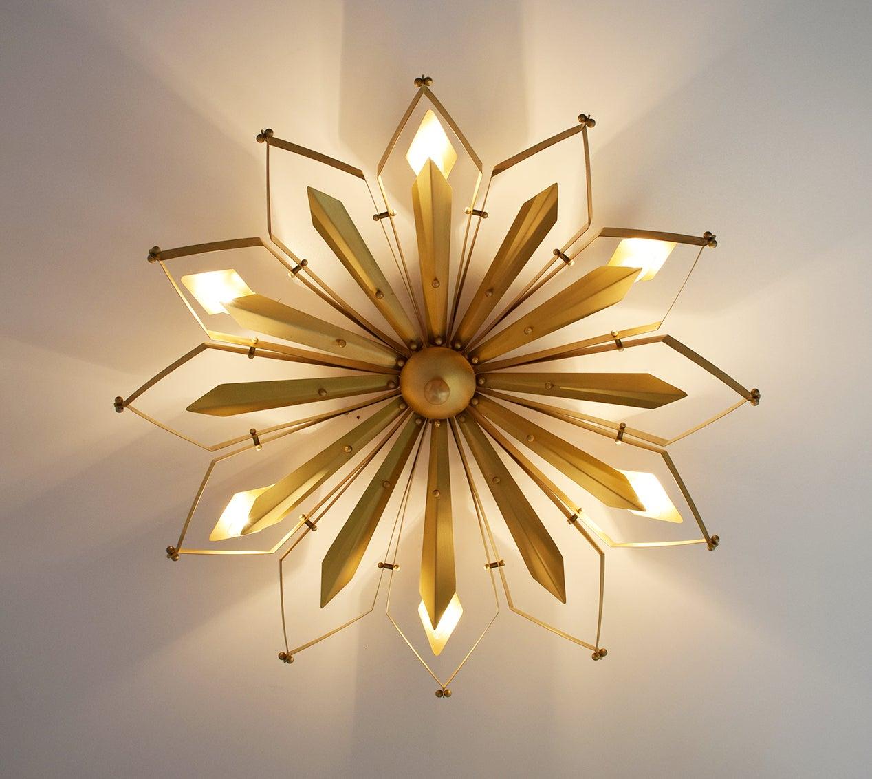 Elegant Italian flushmount with satin brass frame handcrafted to resemble a concave dahlia flower, designed by Fabio Bergomi for Fabio Ltd / Made in Italy
6 lights / E12 or E14 type / max 40W each
Measures: Diameter 37 inches, height 9 inches
Order