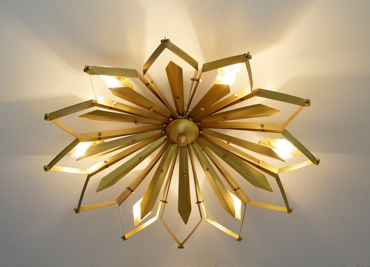 Elegant Italian flush mount with satin brass frame handcrafted to resemble a concave dahlia flower, designed by Fabio Bergomi for Fabio Ltd, made in Italy
6 lights / E12 or E14 type / max 40W each
Measures: Diameter 37 inches, height 9 inches
Order