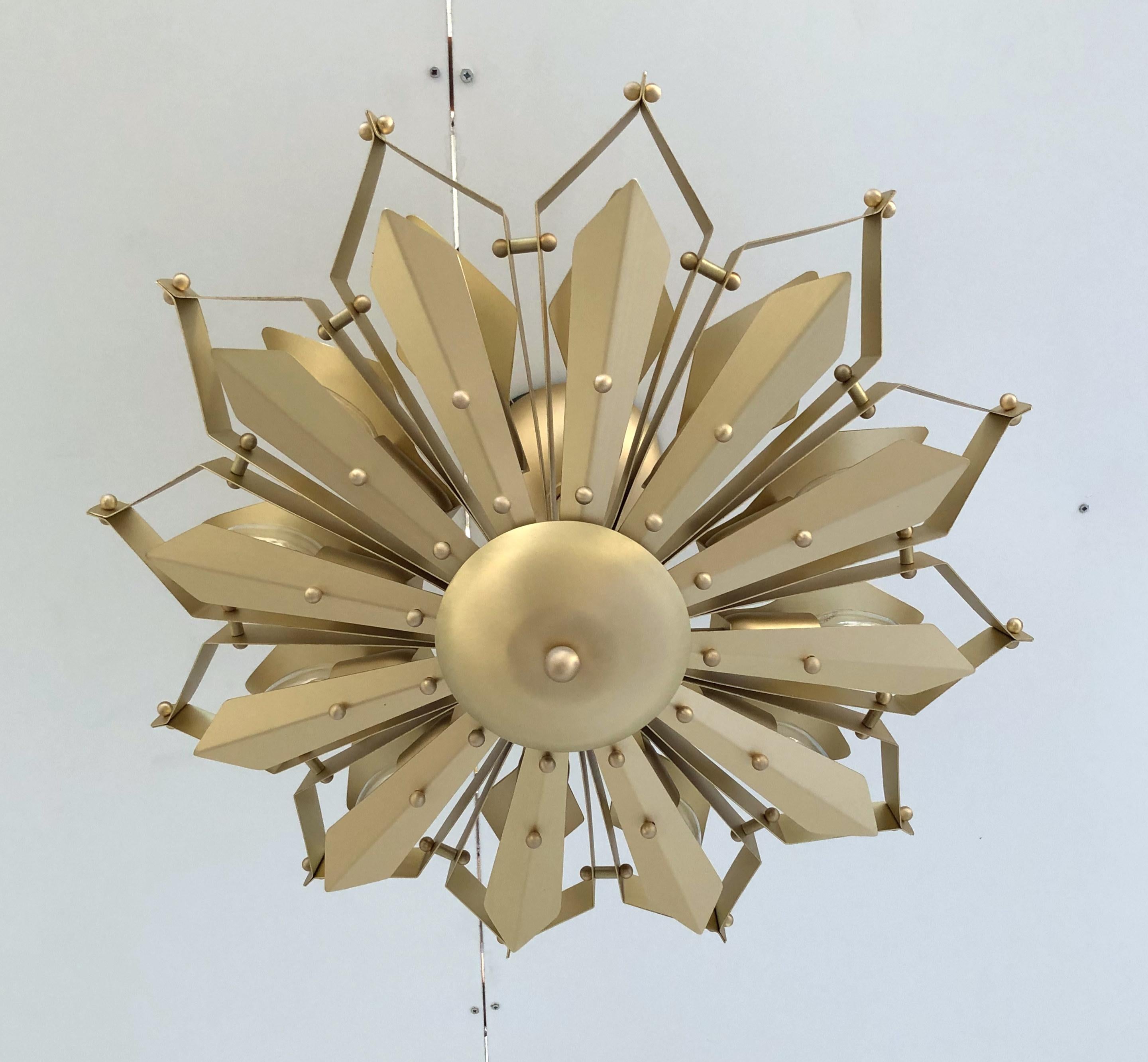 Elegant Italian flushmount with satin brass frame handcrafted to resemble a convex dahlia flower, designed by Fabio Bergomi for Fabio Ltd / made in Italy
12 lights / E12 or E14 type / max 40W each
Measures: diameter 24 inches / height 14