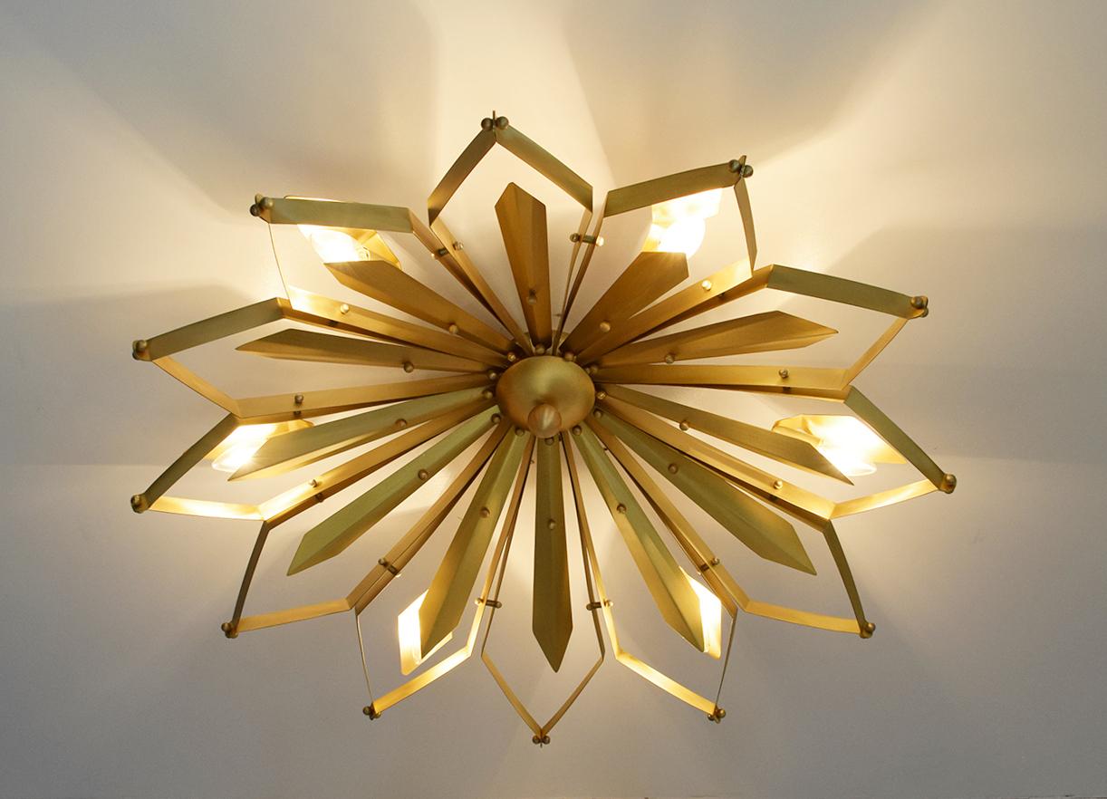 Elegant Italian flush mount with satin brass frame handcrafted to resemble a concave dahlia flower, designed by Fabio Bergomi for Fabio Ltd / Made in Italy
6 lights / E12 or E14 type / max 40W each
Measures: Diameter 37 inches, height 9 inches
Order