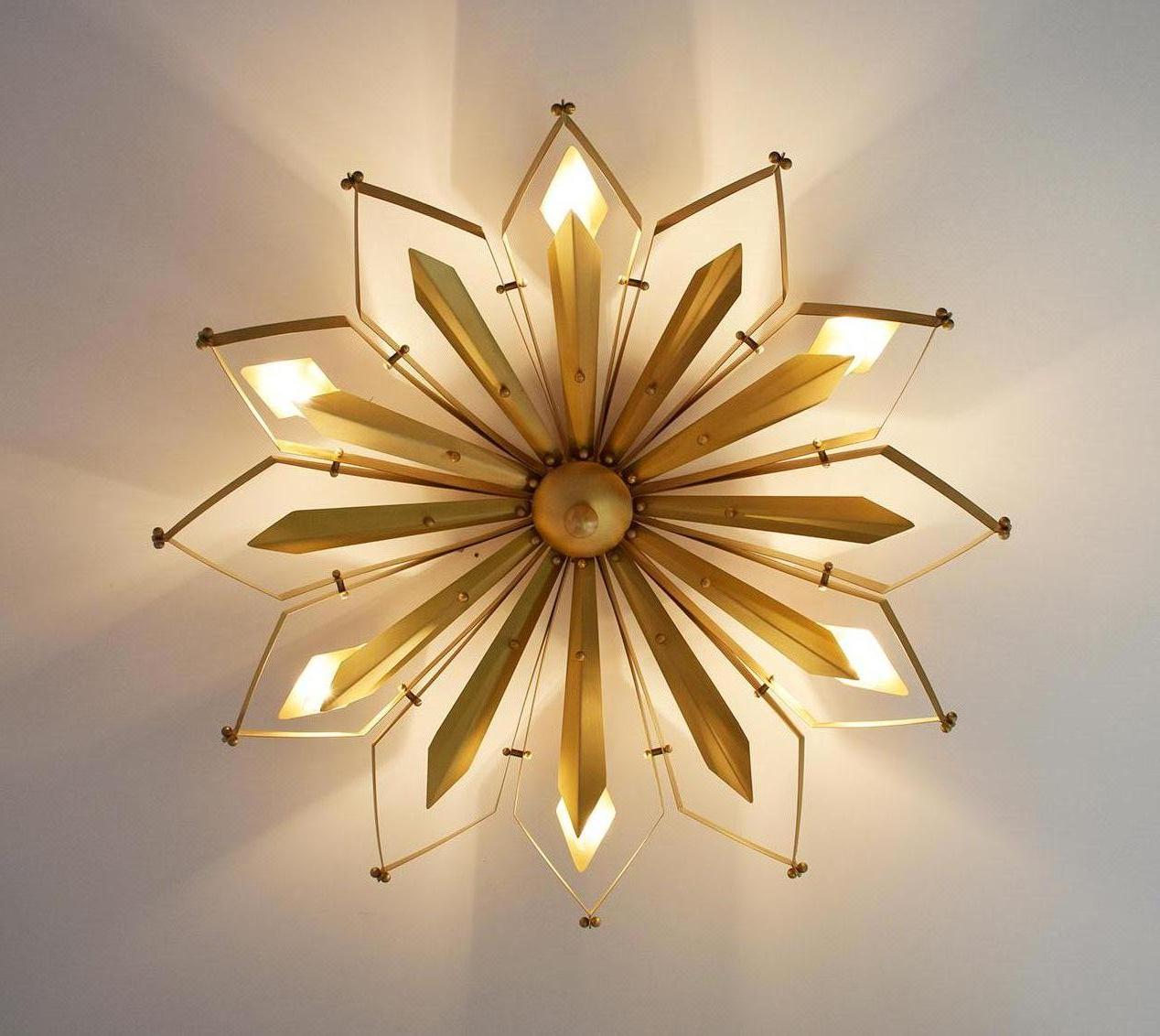 Elegant Italian flushmount with satin brass frame hand crafted to resemble a concave dahlia flower, designed by Fabio Bergomi for Fabio Ltd / Made in Italy
6 lights / E12 or E14 type / max 40W each
Measures: Diameter 37 inches, height 9 inches
Order